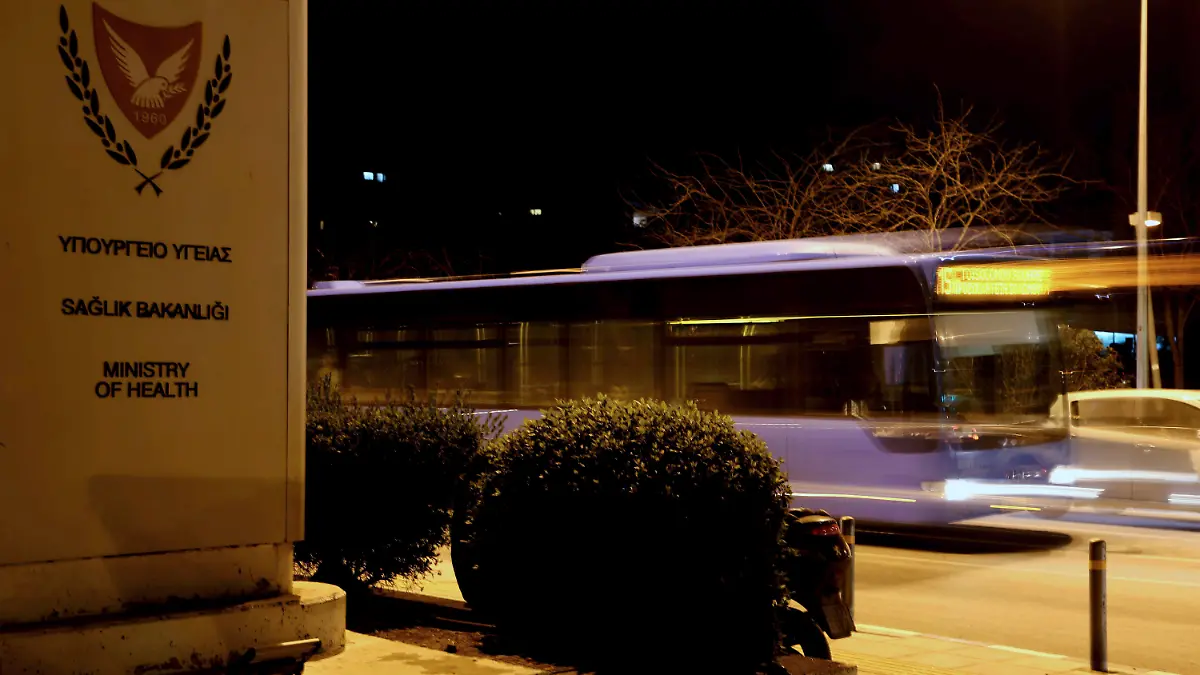A bus passes outside of the health ministry in capital Nicosia, Cyprus, Monday, March 9, 2020. Cyprus' Health Minister Constantinos Ioannou during a statement to the press has confirmed the first two cases of COVID-19, coronavirus, in Cyprus. (AP Photo/Petros Karadjias)