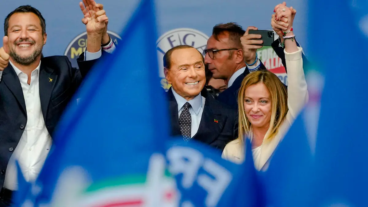 From left, The League's Matteo Salvini, Forza Italia's Silvio Berlusconi, and Brothers of Italy's Giorgia Meloni attend the final rally of the center-right coalition in central Rome, Thursday, Sept. 22, 2022. Italians vote on Sunday for a new Parliament, and they could elect their first far-right premier of the post-war era. If opinion polls hold, Giorgia Meloni could be that premier, as well as become the first woman to lead an Italian government. (AP Photo/Alessandra Tarantino)