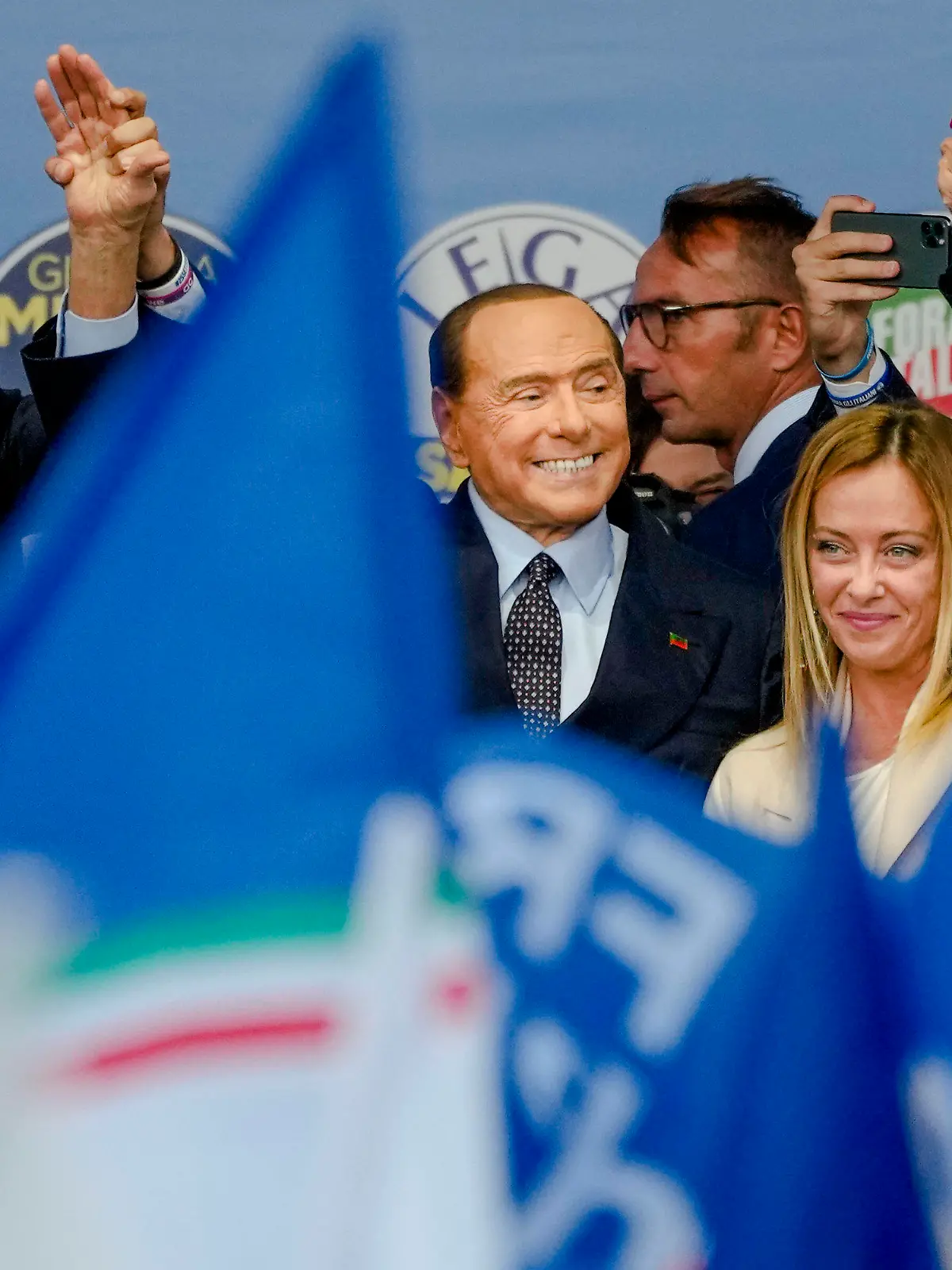 From left, The League's Matteo Salvini, Forza Italia's Silvio Berlusconi, and Brothers of Italy's Giorgia Meloni attend the final rally of the center-right coalition in central Rome, Thursday, Sept. 22, 2022. Italians vote on Sunday for a new Parliament, and they could elect their first far-right premier of the post-war era. If opinion polls hold, Giorgia Meloni could be that premier, as well as become the first woman to lead an Italian government. (AP Photo/Alessandra Tarantino)