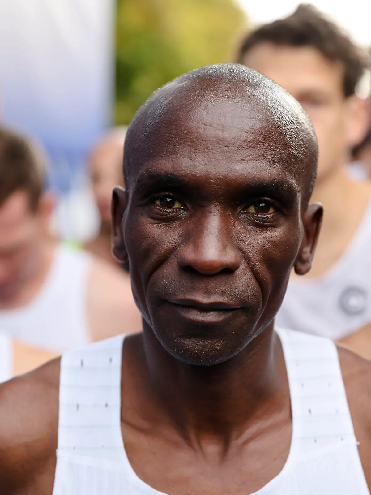 Eliud Kipchoge, center, waits for the start of the Berlin Marathon in Berlin, Germany, Sunday, Sept. 25, 2022. (AP Photo/Christoph Soeder)