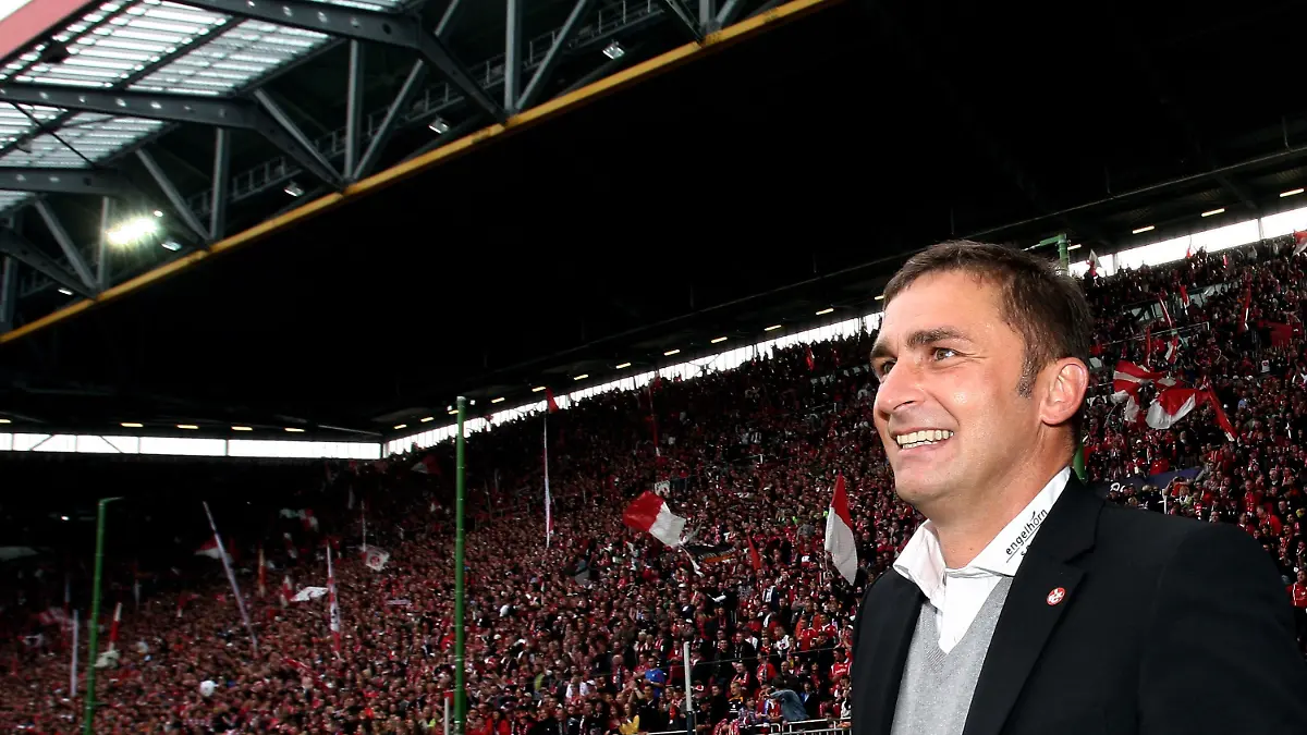KAISERSLAUTERN, GERMANY - MAY 09: President Stefan Kuntz pauses after the Second Bundesliga match between 1. FC Kaiserslautern and FC Augsburg at the Fritz-Walter Stadium on May 9, 2010 in Kaiserslautern, Germany. (Photo by Alex Grimm/Bongarts/Getty Images)