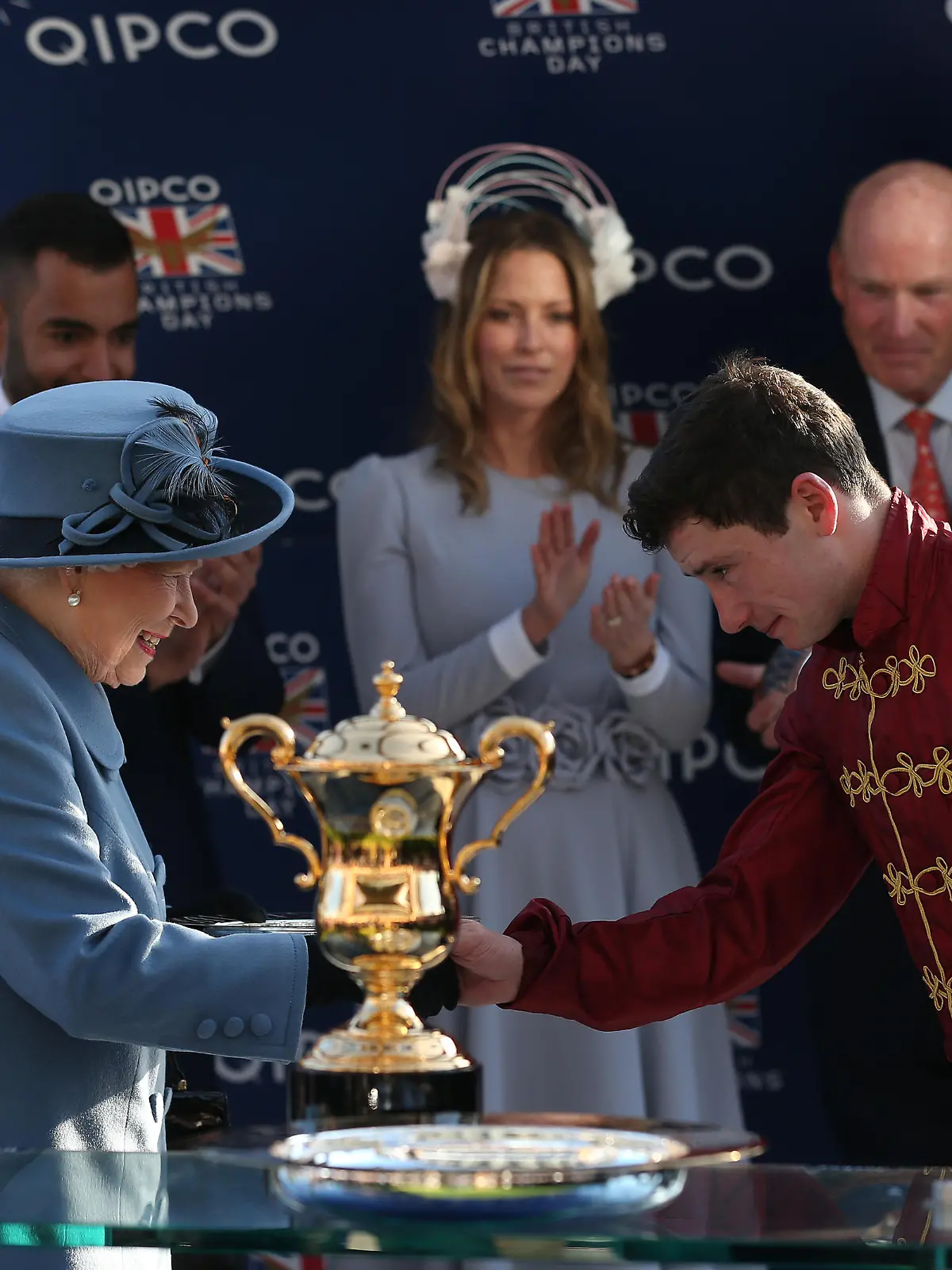 QIPCO British Champions Day - Ascot Races. Queen Elizabeth II presents Oisin Murphy with his trophy after Roaring Lion won The Queen Elizabeth II Stakes Race run during QIPCO British Champions Day at Ascot Racecourse. Picture date: Saturday October 20, 2018. See PA story RACING Ascot. Photo credit should read: Julian Herbert/PA Wire. RESTRICTIONS: Use subject to restrictions. Editorial use only, no commercial or promotional use. No private sales. URN:39226709