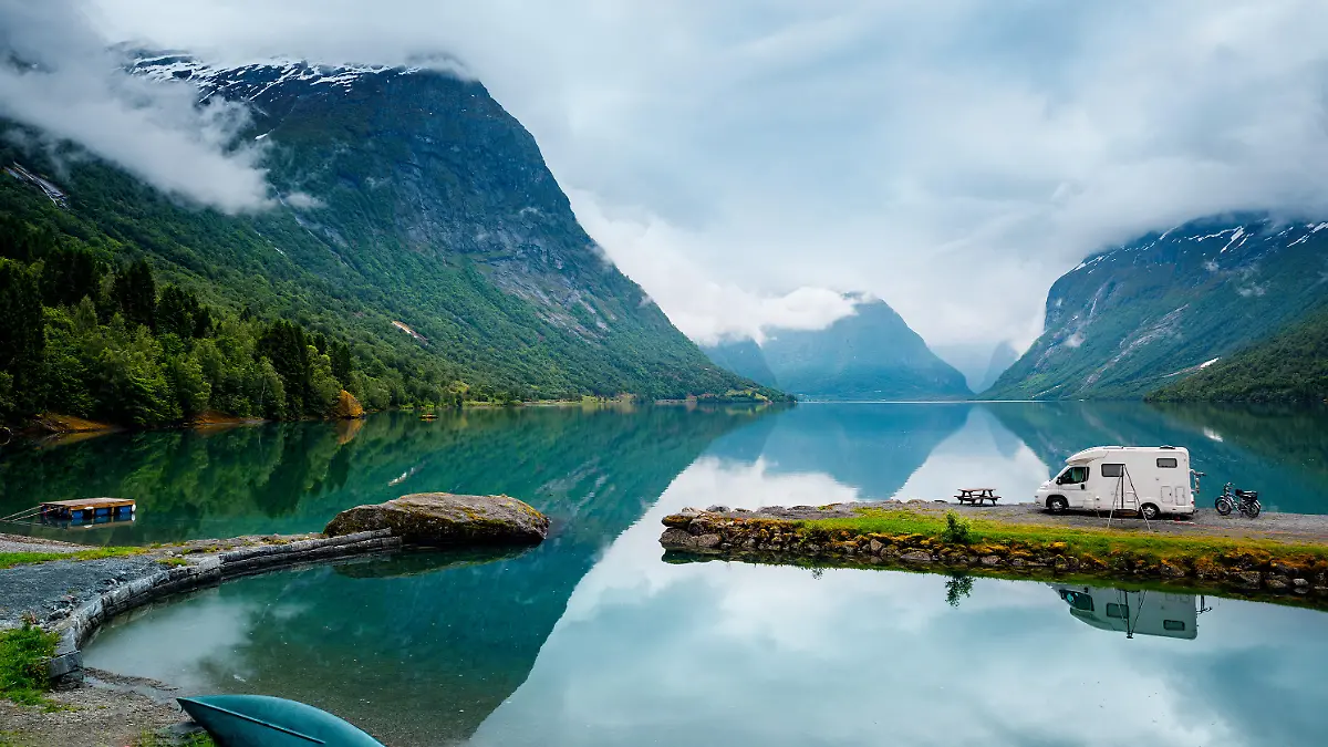 Family vacation travel RV, holiday trip in motorhome, Caravan car Vacation. Beautiful Nature Norway natural landscape.