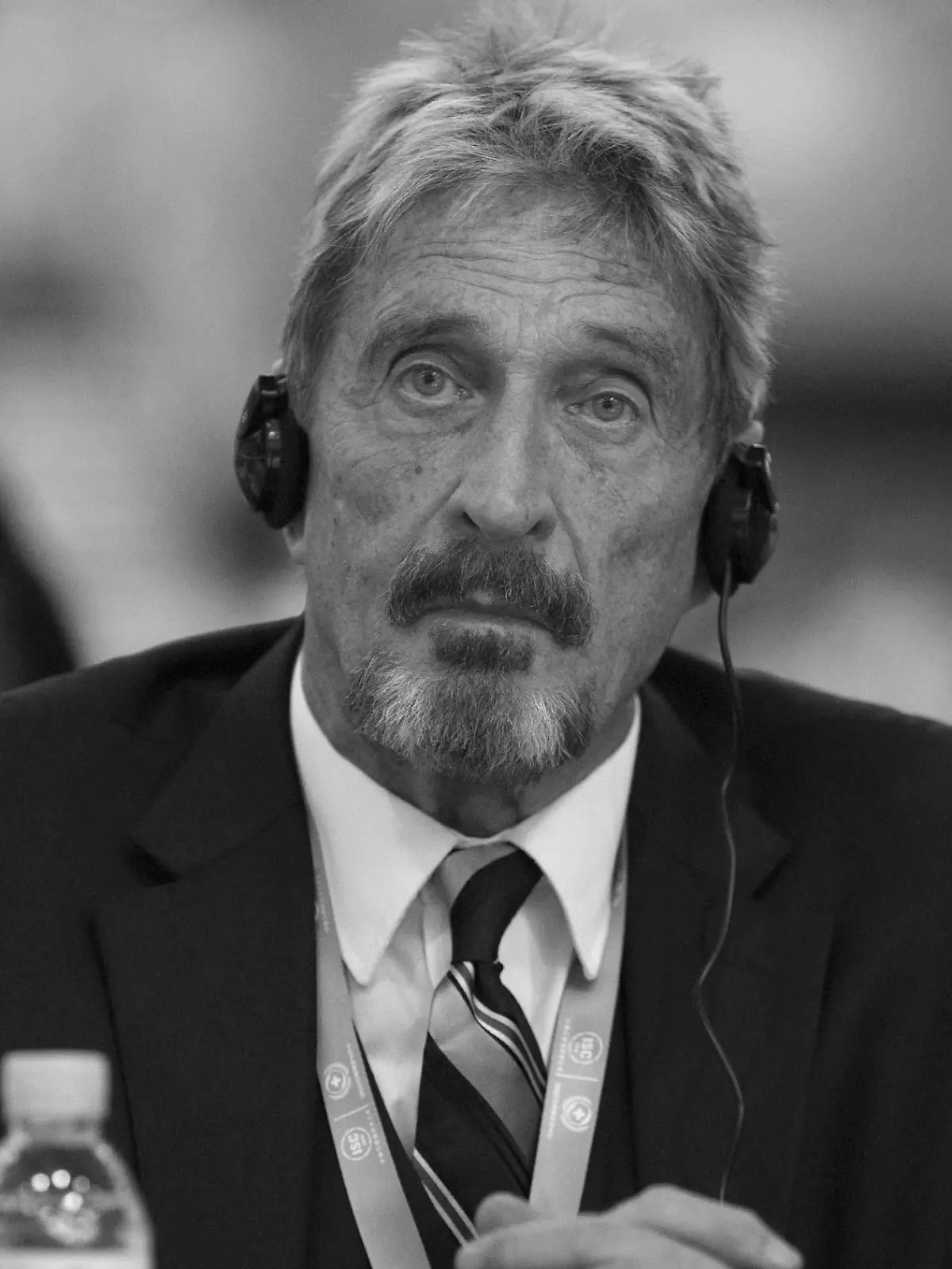 FILE - In this Tuesday, Aug. 16, 2016 file photo, founder of the first commercial anti-virus program that bore his name, John McAfee listens during the 4th China Internet Security Conference (ISC) in Beijing. John McAfee, the creator of the antivirus named after him, has been found dead in a cell of a jail near Barcelona, a government source told The Associated Press on Wednesday June 23, 2021 on the same day that a Spanish court issued a preliminary ruling in favor of his extradition to the United States to face tax-related criminal charges. (AP Photo/Ng Han Guan, File)
