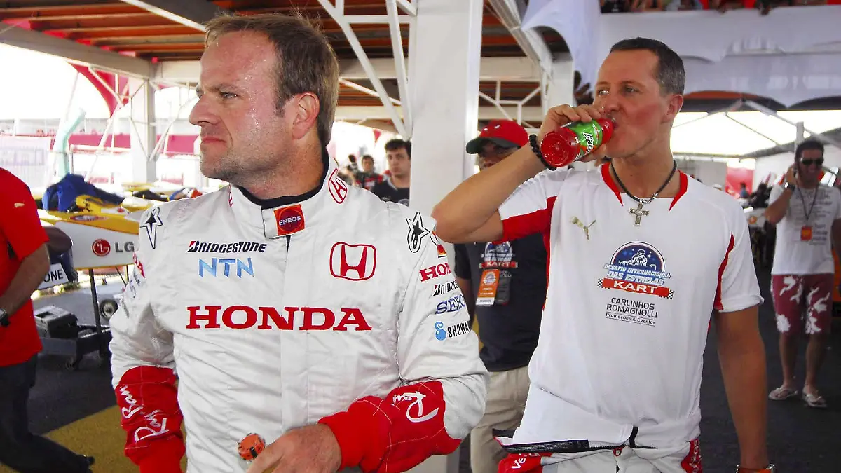 Der ehemalige Formel-1-Pilot Michael Schumacher (r) aus Deutschland und der brasilianische Honda-Pilot Rubens Barrichello bei einer Pause während eines Kart-Trainings am 24.11.2007 in Florianopolis, Brasilien. Foto: Miguel Costa Jr EDITORIAL USE ONLY +++(c) dpa - Report+++