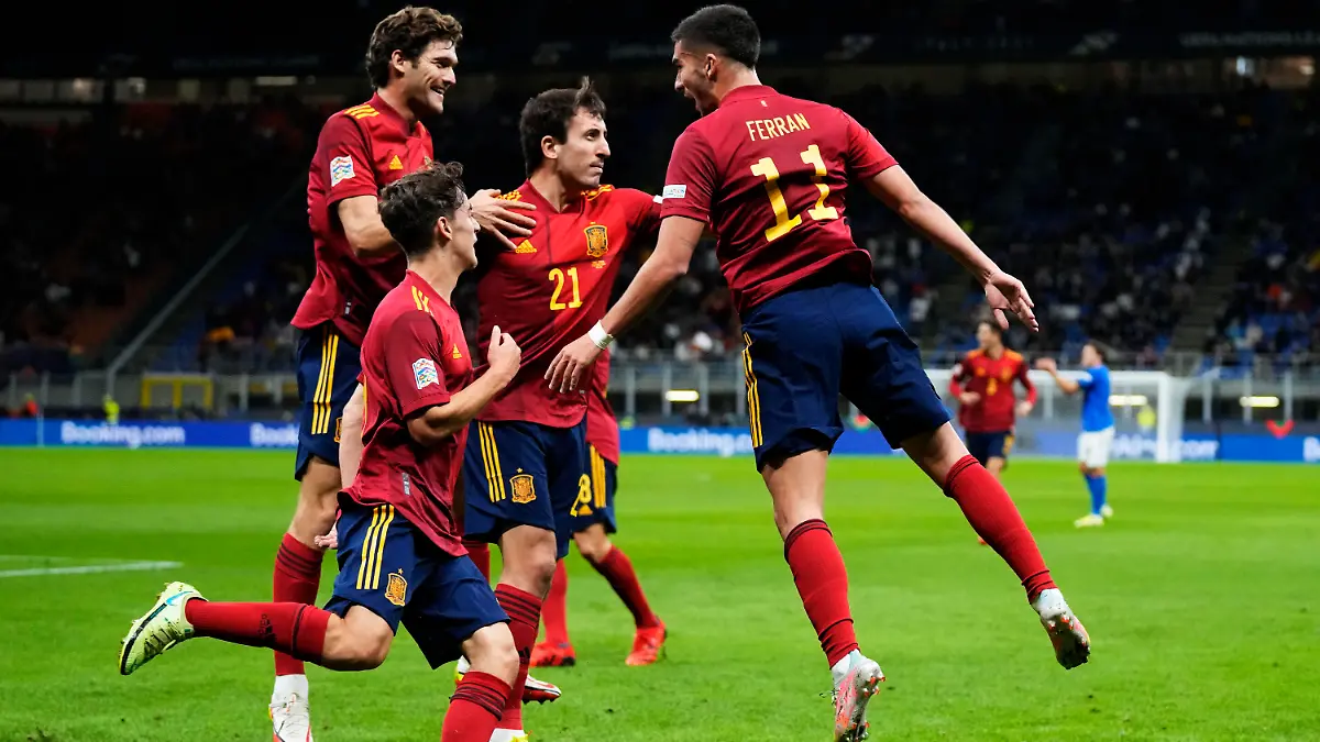 Spain's Ferran Torres, right, celebrates with teammates after scoring during the UEFA Nations League semifinal soccer match between Italy and Spain at the San Siro stadium, in Milan, Italy, Wednesday, Oct. 6, 2021. (AP Photo/Antonio Calanni)