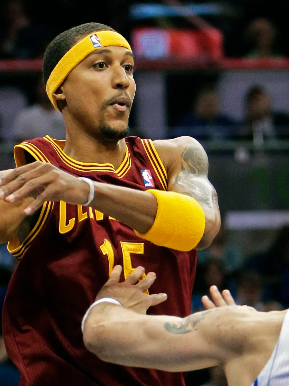 FILE - Cleveland Cavaliers' Jamario Moon, left, makes a pass over the head of Orlando Magic's Marcin Gortat (13), of Poland, during the first half of an NBA basketball game in Orlando, Fla., in this Friday, Nov. 26, 2010, file photo. Eighteen former NBA players, including Moon, have been arrested on charges alleging they defrauded the league's health and welfare benefit plan out of about $4 million, according to an indictment Thursday, Oct. 7, 2021. (AP Photo/John Raoux, File)