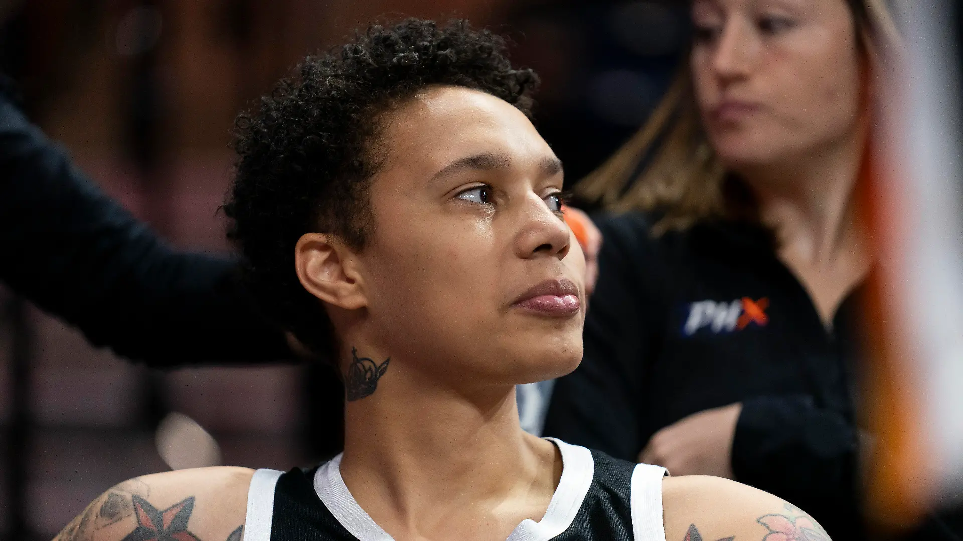 Phoenix Mercury center Brittney Griner watches teammates warm up on the court before a WNBA basketball game against the Washington Mystics, Sunday, July 23, 2023, in Washington. (AP Photo/Stephanie Scarbrough)