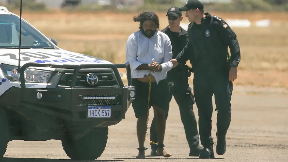 CARNARVON , AUSTRALIA - NOVEMBER 5: Terence Darrell Kelly boards a plane after being taken into custody by members of the Special Operations Group at Carnarvon airport on November 5, 2021 in Carnarvon , Australia. Kelly, 36, has been charged with various offences relating to the disappearance of Cleo Smith, 4, who was abducted from a campsite in the Gascoyne region on October 16th and found alive on November 3rd. He is being transported to Perth and will re-appear in court In December. (Photo by Tamati Smith/Getty Images)