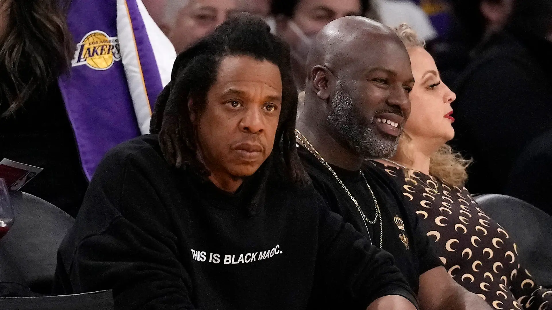 JAY-Z, left, watches during the first half of an NBA basketball game between the Los Angeles Lakers and the Oklahoma City Thunder Tuesday, Feb. 7, 2023, in Los Angeles. (AP Photo/Ashley Landis)