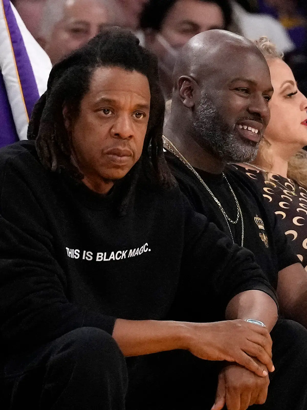 JAY-Z, left, watches during the first half of an NBA basketball game between the Los Angeles Lakers and the Oklahoma City Thunder Tuesday, Feb. 7, 2023, in Los Angeles. (AP Photo/Ashley Landis)