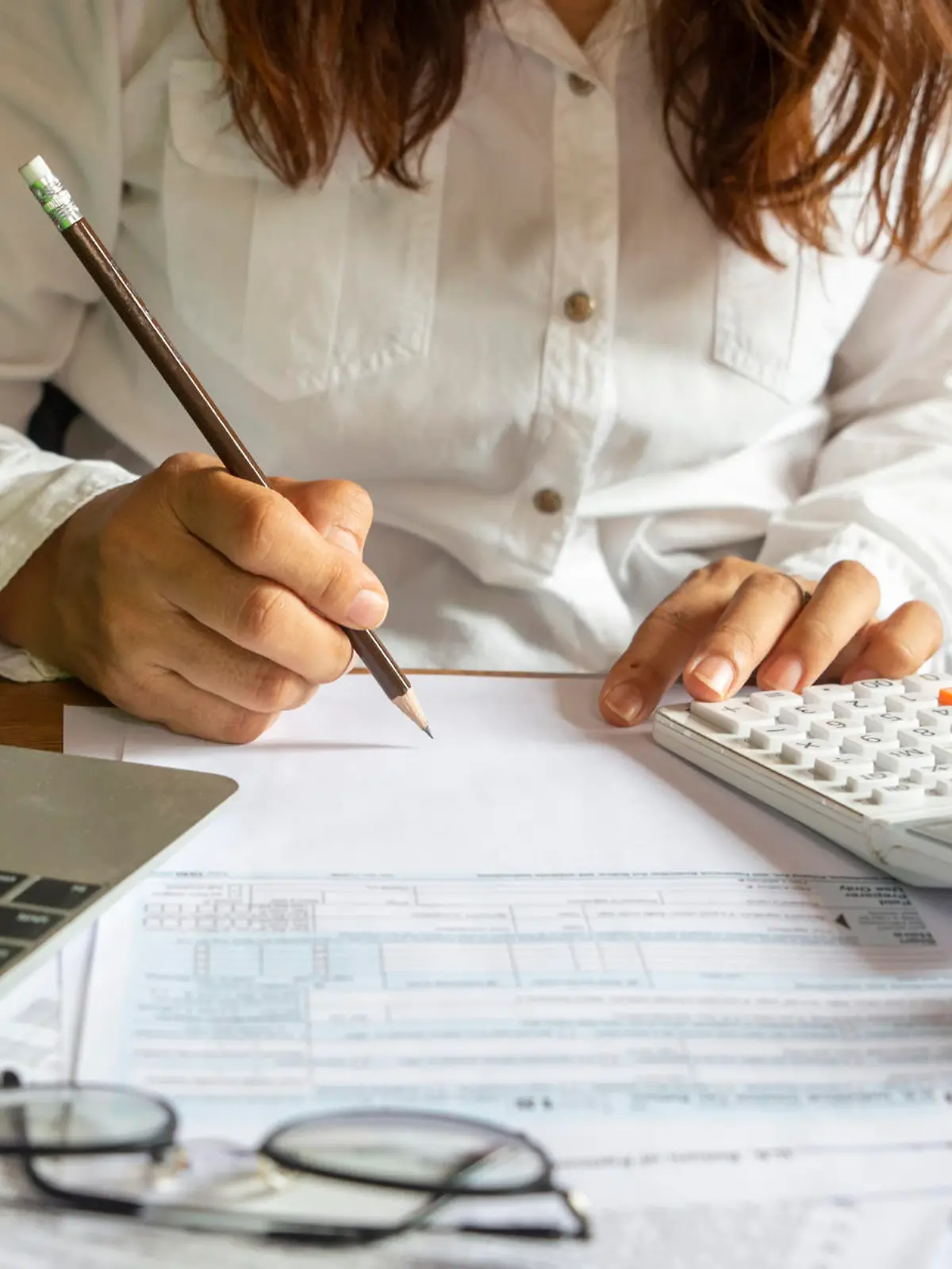 Budget planning concept,Accountant is calculating company's annual tax.Calendar 2019 and personal income tax forms for those who have income under US law placed on office desk.This is the season to pay taxes.