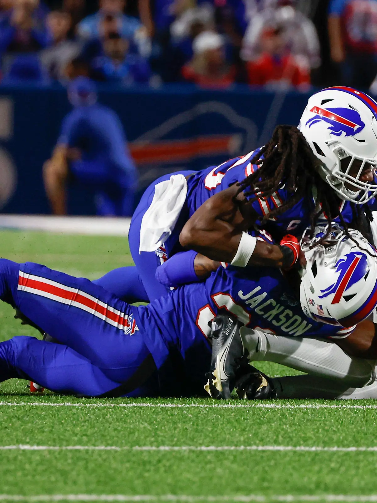 Buffalo Bills cornerback Dane Jackson, bottom, is injured on a play during the first half of an NFL football game against the Tennessee Titans, Monday, Sept. 19, 2022, in Orchard Park, N.Y. (AP Photo/Jeffrey T. Barnes)