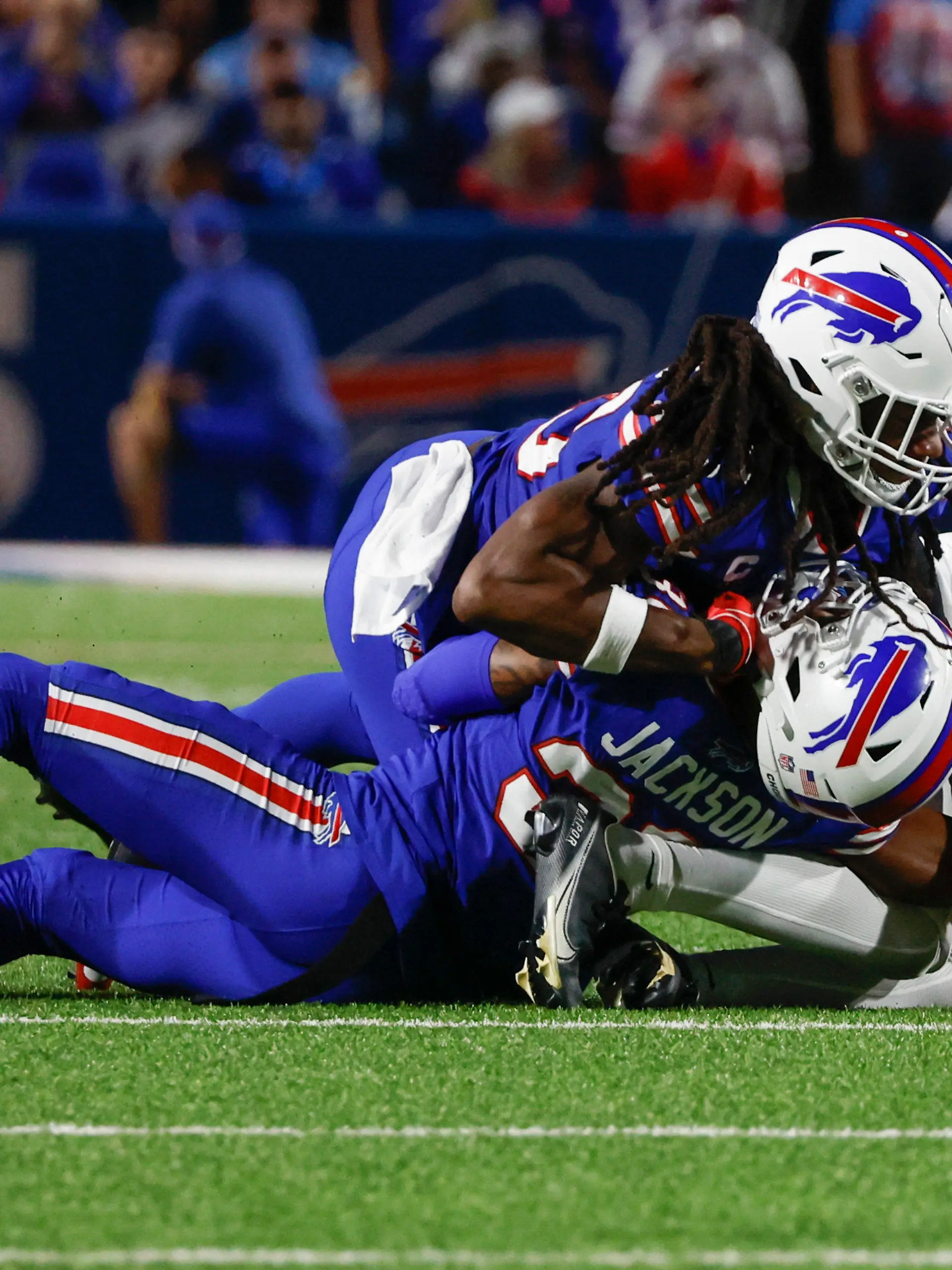 Buffalo Bills cornerback Dane Jackson, bottom, is injured on a play during the first half of an NFL football game against the Tennessee Titans, Monday, Sept. 19, 2022, in Orchard Park, N.Y. (AP Photo/Jeffrey T. Barnes)