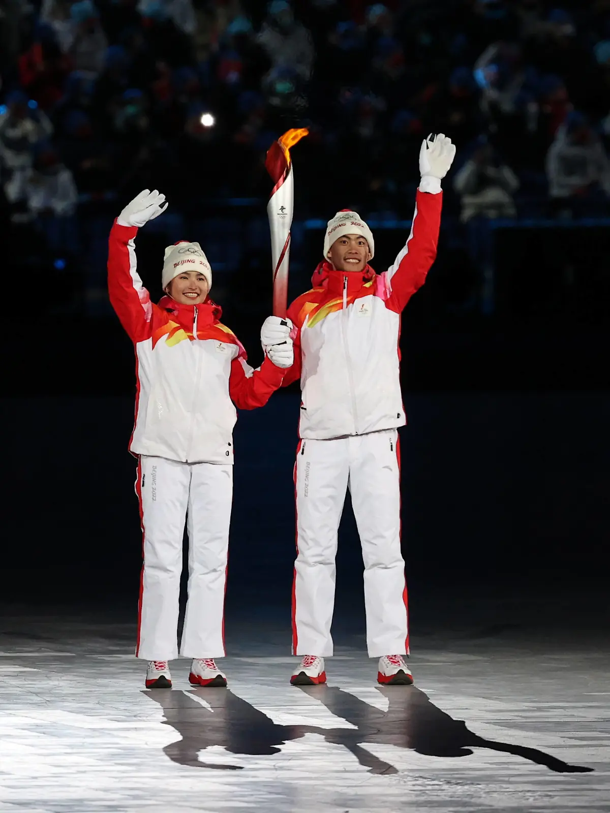 BEIJING, CHINA  FEBRUARY 4, 2022: Chinese athletes Dinigeer Yilamujiang and Zhao Jiawen light the snowflake-shaped Olympic cauldron at the opening ceremony of the Beijing 2022 Winter Olympic Games, Olympische Spiele, Olympia, OS at the National Stadium also known as the Bird s Nest. Sergei Bobylev/TASS PUBLICATIONxINxGERxAUTxONLY TS121559 