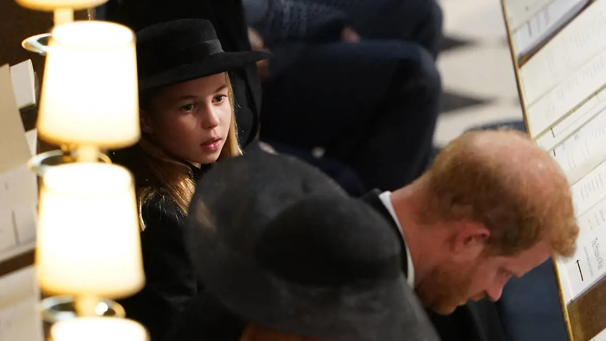 Britain's Princess Charlotte of Wales sits with Britain's Prince William, Prince of Wales, Britain's Prince George of Wales, Britain's Catherine, Princess of Wales, Britain's Prince Harry, Duke of Sussex and Meghan, Duchess of Sussex during the Committal Service for Britain's Queen Elizabeth II in St George's Chapel inside Windsor Castle on September 19, 2022. - Monday's committal service is expected to be attended by at least 800 people, most of whom will not have been at the earlier State Funeral at Westminster Abbey. (Photo by Joe Giddens / POOL / AFP) (Photo by JOE GIDDENS/POOL/AFP via Getty Images)