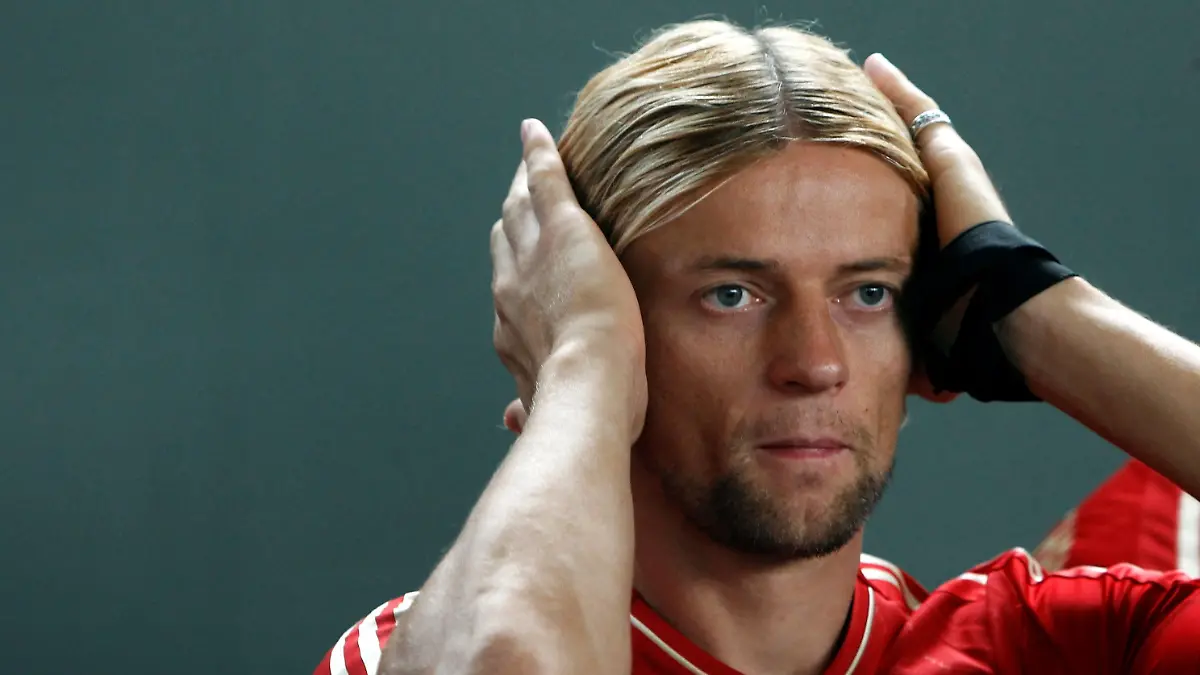 FILE PHOTO: Anatoliy Tymoshchuk reacts during a photo call in Munich July 30, 2012, when he was a player for Bayern Munich. REUTERS/Michaela Re/File Photo