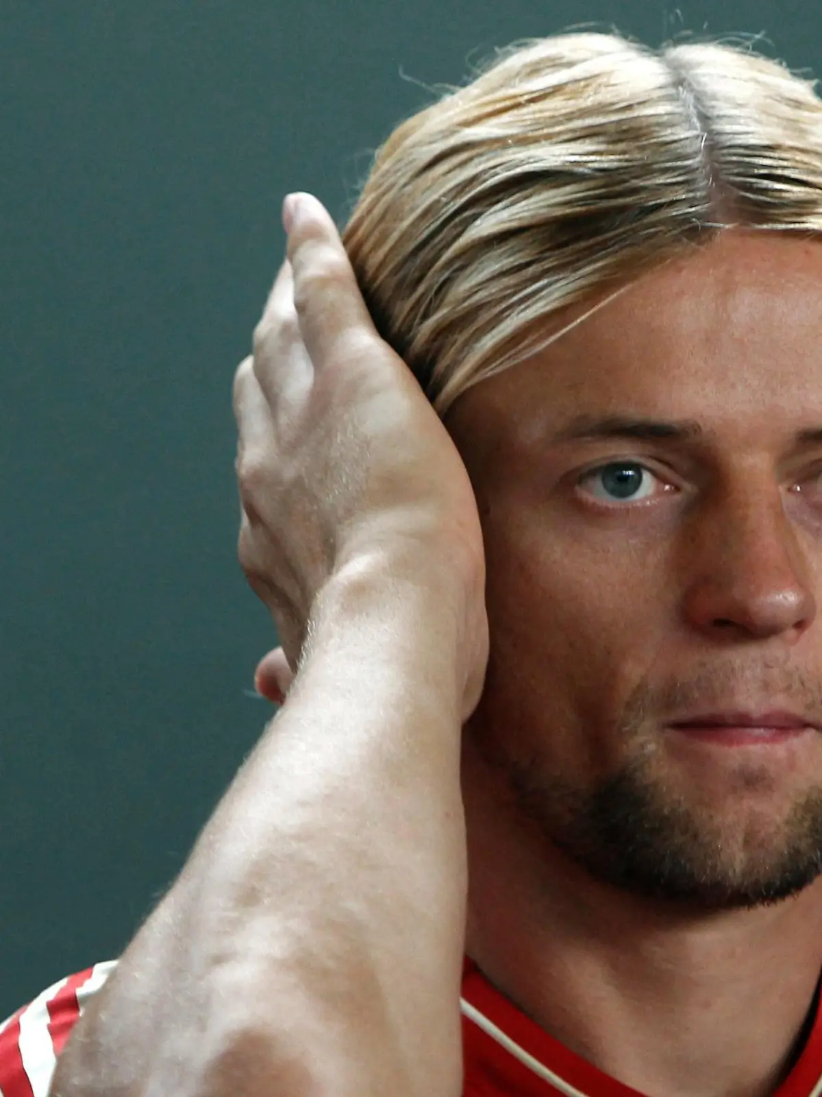 FILE PHOTO: Anatoliy Tymoshchuk reacts during a photo call in Munich July 30, 2012, when he was a player for Bayern Munich. REUTERS/Michaela Re/File Photo