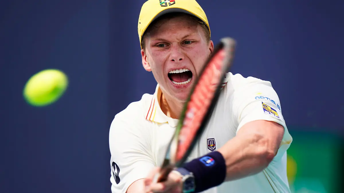 Jenson Brooksby returns a shot from Federico Coria of Argentina, during the Miami Open tennis tournament, Thursday, March 24, 2022, in Miami Gardens, Fla. (AP Photo/Wilfredo Lee)