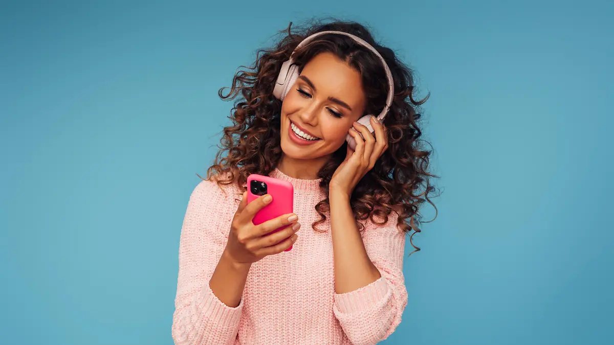 Beautiful emotional woman listening to music