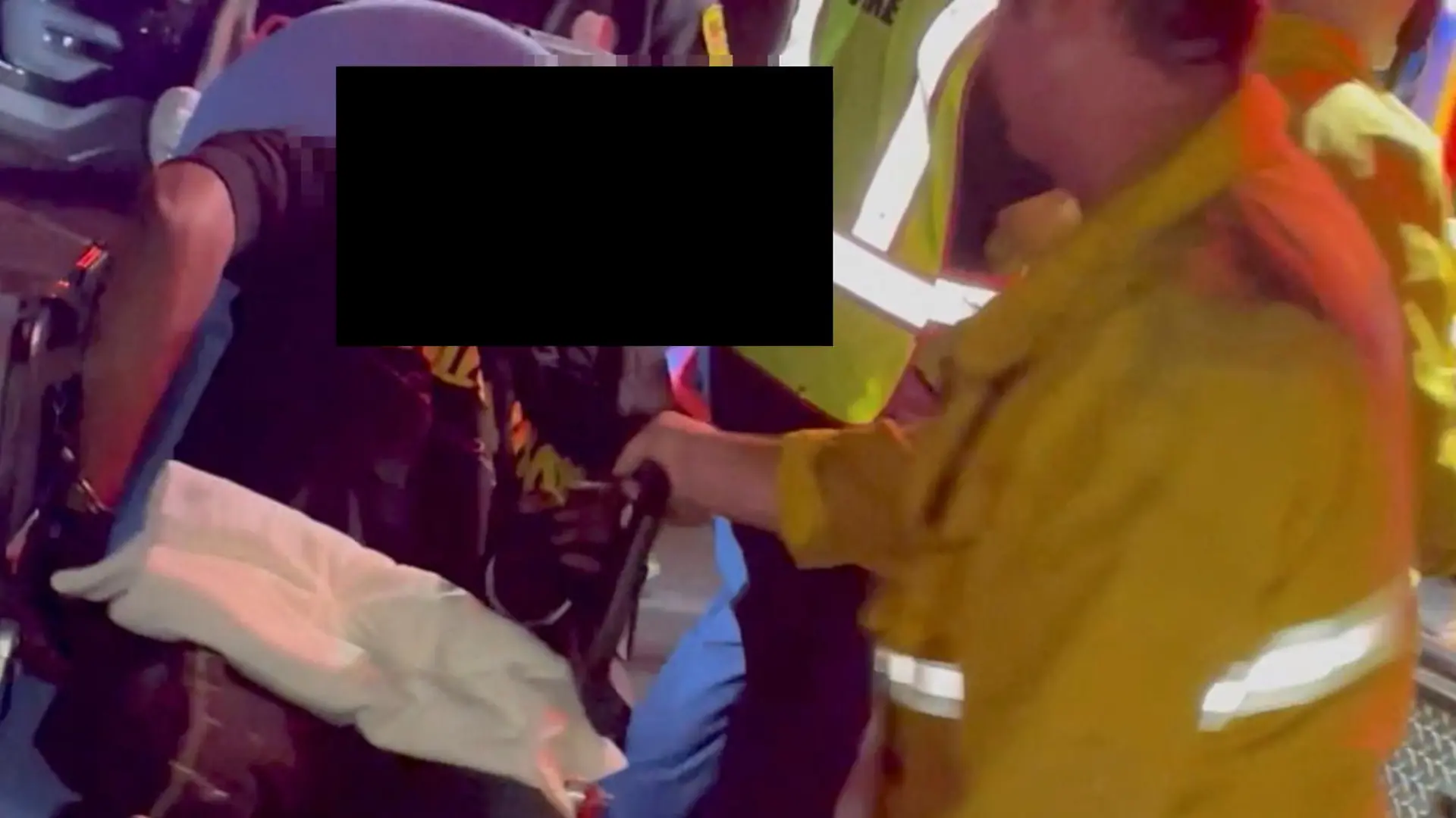A man is transported into an ambulance after comedian Dave Chappelle was attacked on stage during stand-up Netflix show at the Hollywood Bowl, in Los Angeles, U.S., May 3, 2022, in this still image obtained from a social media video. Theodore Nwajei/via REUTERS THIS IMAGE HAS BEEN SUPPLIED BY A THIRD PARTY. MANDATORY CREDIT.