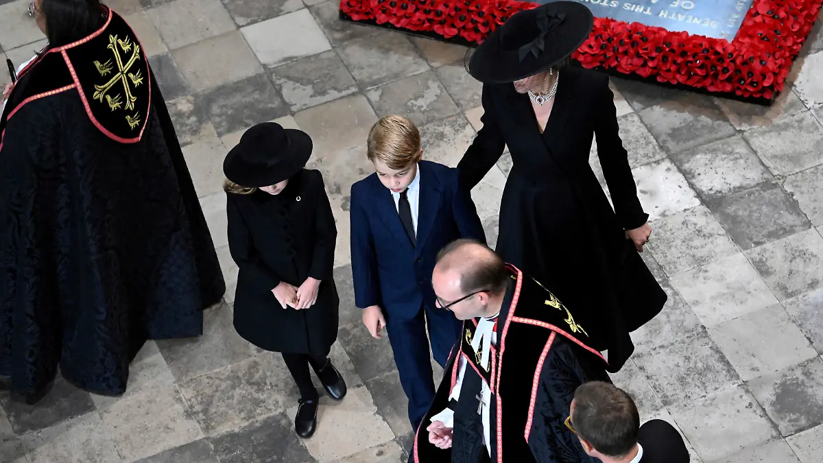 Kate, Princess of Wales, Price George and Princess Charlotte arrive at Westminster Abbey ahead of the State Funeral of Britain's Queen Elizabeth II, in London Monday Sept. 19, 2022. The Queen, who died aged 96 on Sept. 8, will be buried at Windsor alongside her late husband, Prince Philip, who died last year. (Gareth Cattermole/Pool Photo via AP)