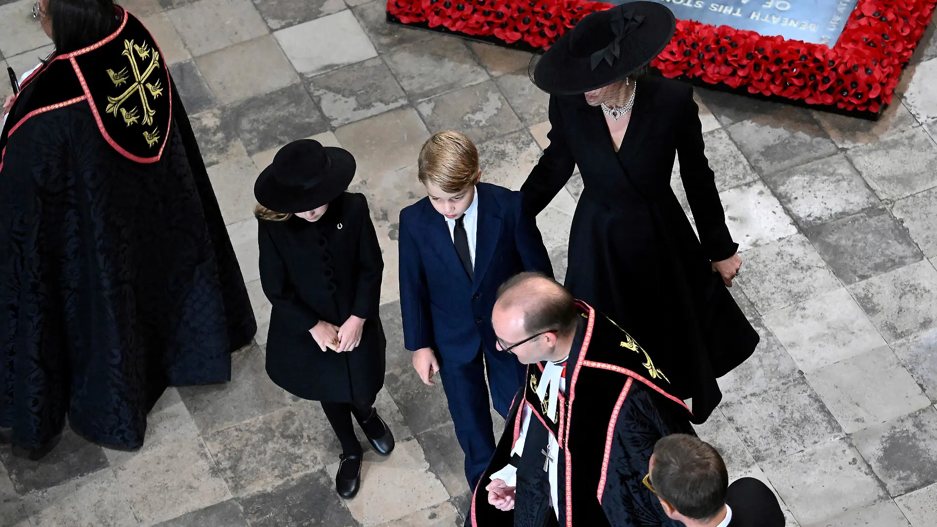 Kate, Princess of Wales, Price George and Princess Charlotte arrive at Westminster Abbey ahead of the State Funeral of Britain's Queen Elizabeth II, in London Monday Sept. 19, 2022. The Queen, who died aged 96 on Sept. 8, will be buried at Windsor alongside her late husband, Prince Philip, who died last year. (Gareth Cattermole/Pool Photo via AP)