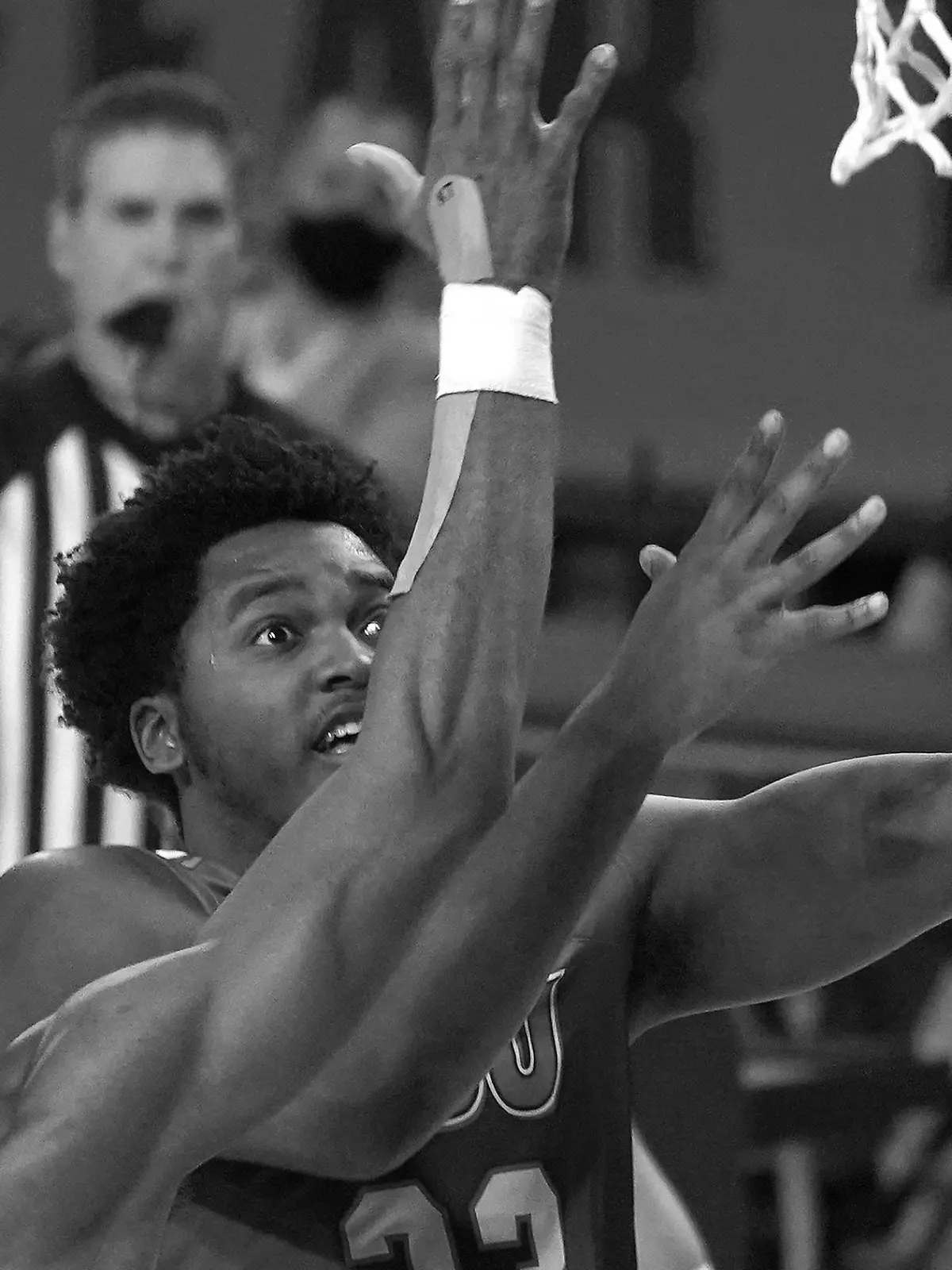 FILE - Houston Baptist guard Darius Lee (23) jumps for a layup during the first half of an NCAA college basketball game against Arizona State, Nov. 29, 2020, in Tempe, Ariz. Lee was killed and eight other people were wounded Monday, June 20, 2022 in an early-morning shooting at a gathering in Harlem, New York City police said. (AP Photo/Rick Scuteri, file)