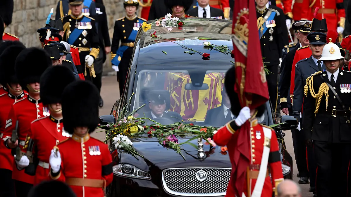 The Royal State Hearse carrying the coffin of Queen Elizabeth II arrives at Windsor Castle for the Committal Service for Queen Elizabeth II, in Windsor, England, Monday, Sept. 19, 2022. (Leon Neal/Pool photo via AP)