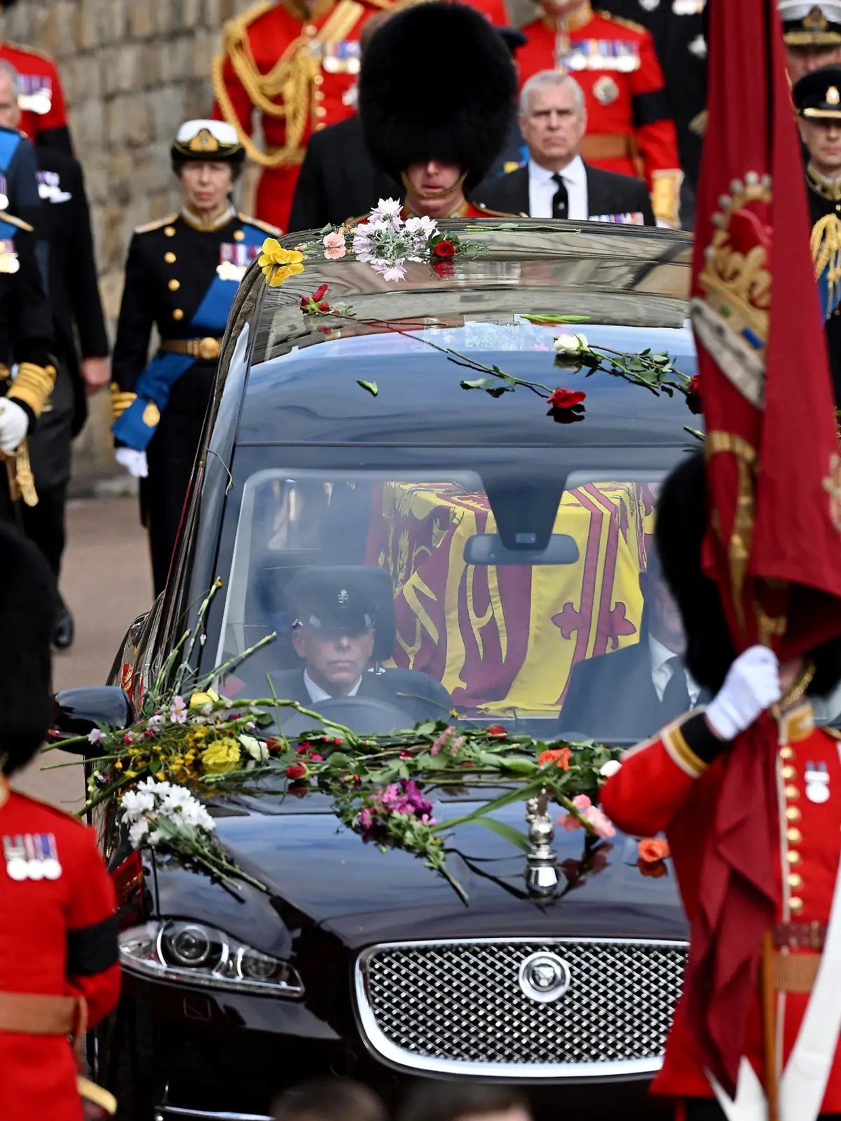 The Royal State Hearse carrying the coffin of Queen Elizabeth II arrives at Windsor Castle for the Committal Service for Queen Elizabeth II, in Windsor, England, Monday, Sept. 19, 2022. (Leon Neal/Pool photo via AP)
