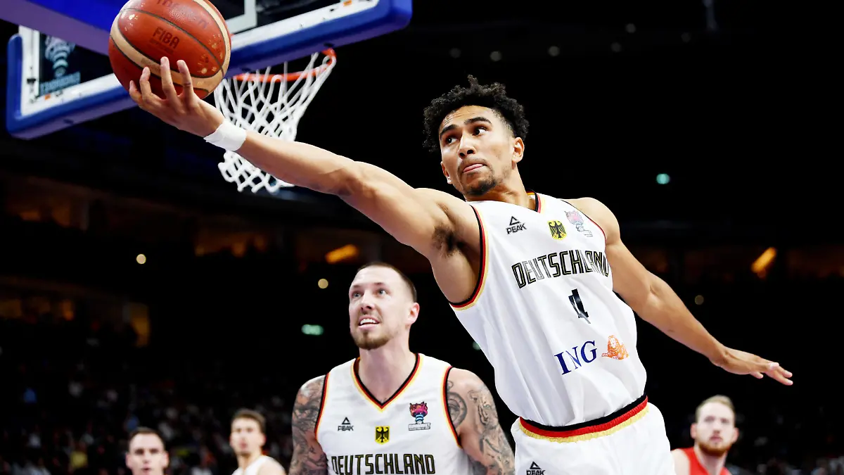 Basketball - EuroBasket Championship - Third Place Playoff - Germany v Poland - Mercedes-Benz Arena, Berlin, Germany - September 18, 2022  Germany's Maodo Lo and Daniel Theis in action REUTERS/Annegret Hilse