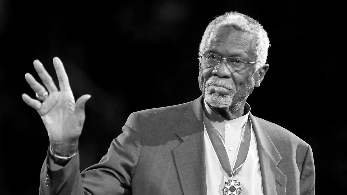FILE PHOTO: Boston Celtics' legend Bill Russell stands with his Presidential Medal of Freedom during the NBA All-Star basketball game in Los Angeles, February 20, 2011. REUTERS/Danny Moloshok/File Photo