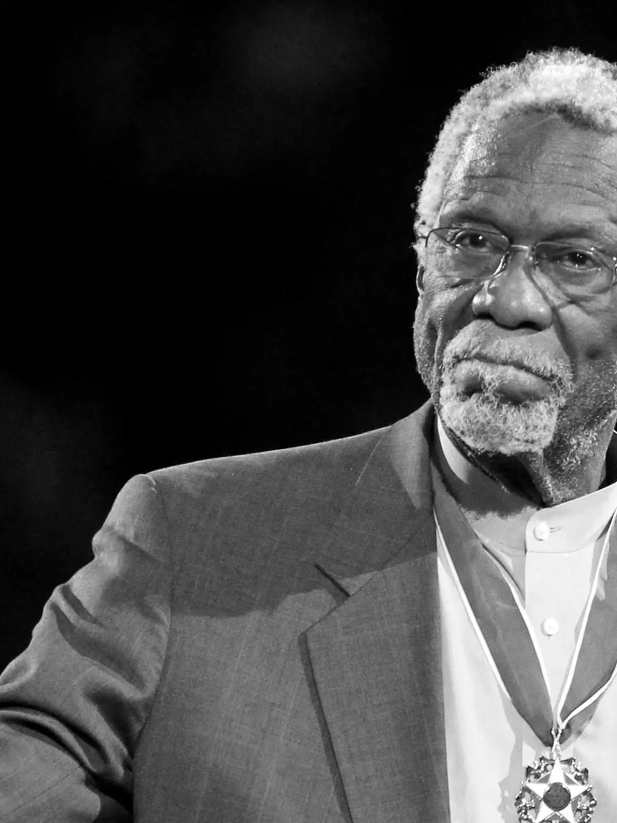 FILE PHOTO: Boston Celtics' legend Bill Russell stands with his Presidential Medal of Freedom during the NBA All-Star basketball game in Los Angeles, February 20, 2011.  REUTERS/Danny Moloshok/File Photo