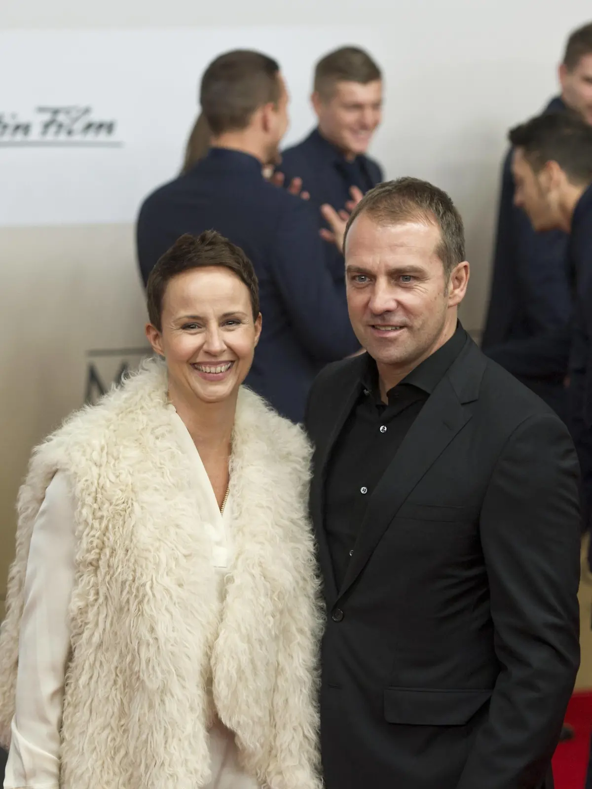  Auf dem Roten Teppich: Hans-Dieter FLICK mit seiner Frau Silke Vorstellung und Weltpremiere des Dokumentarfilmes Die Mannschaft im CineStar Sony Center in Berlin, Deutschland am 10.11.2014, die Deutsche Fussballnationalmannschaft zeigt sich in einem Film zur Fussballweltmeisterschaft 2014 in Brasilien.