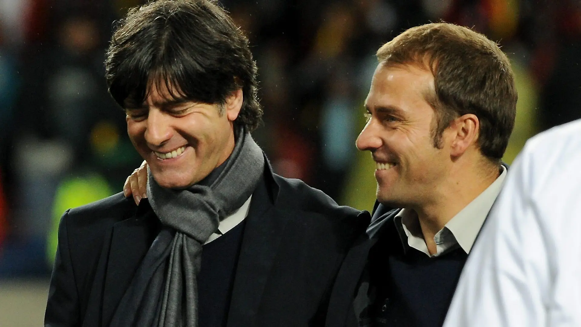 German coach Joachim Loew (L) and assistent coach Hans-Dieter Flick smile after the 2010 FIFA World Cup third place match between Uruguay and Germany at the Nelson Mandela Bay Stadium in Port Elizabeth, South Africa 10 July 2010. Germany won 3:2. Photo: Marcus Brandt dpa - Please refer to http://dpaq.de/FIFA-WM2010-TC +++(c) dpa - Bildfunk+++