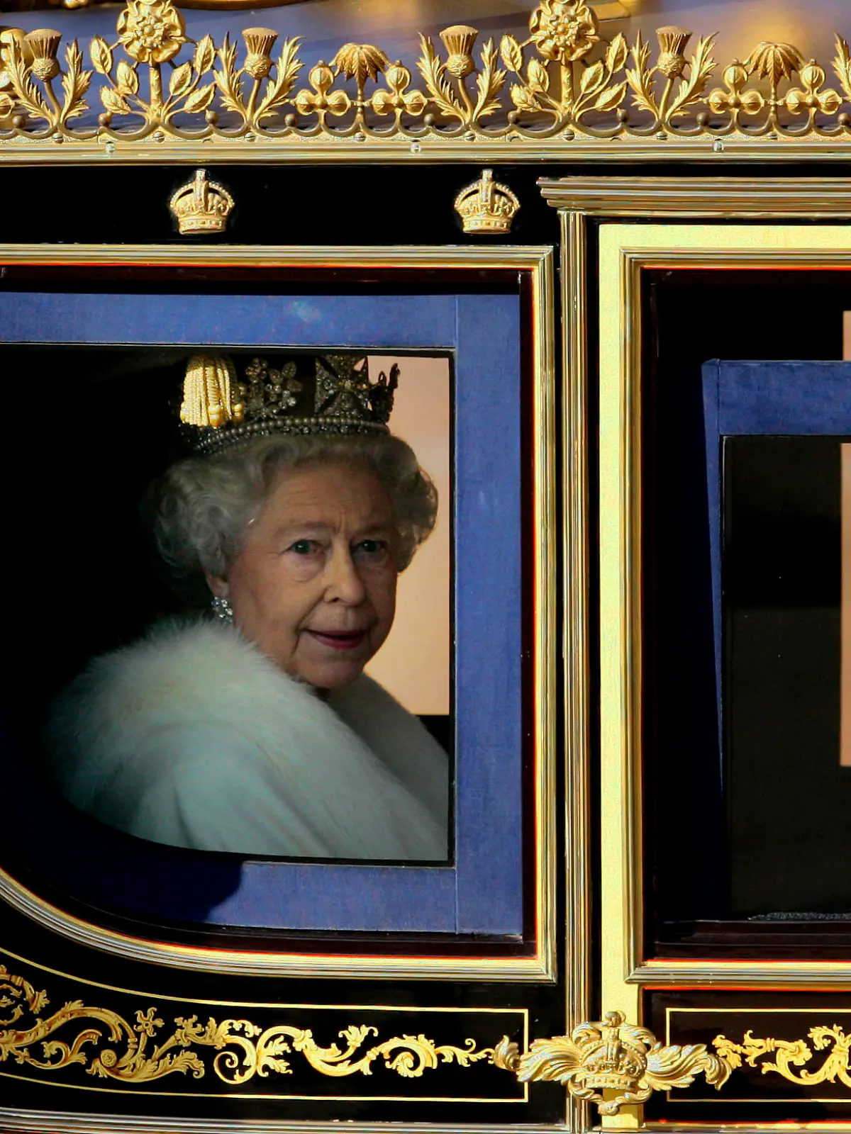 Britain's Queen Elizabeth II leaves Buckingham Palace in a carriage to attend the State opening of Parliament in London, Nov. 6, 2007. (AP Photo/Kirsty Wigglesworth)