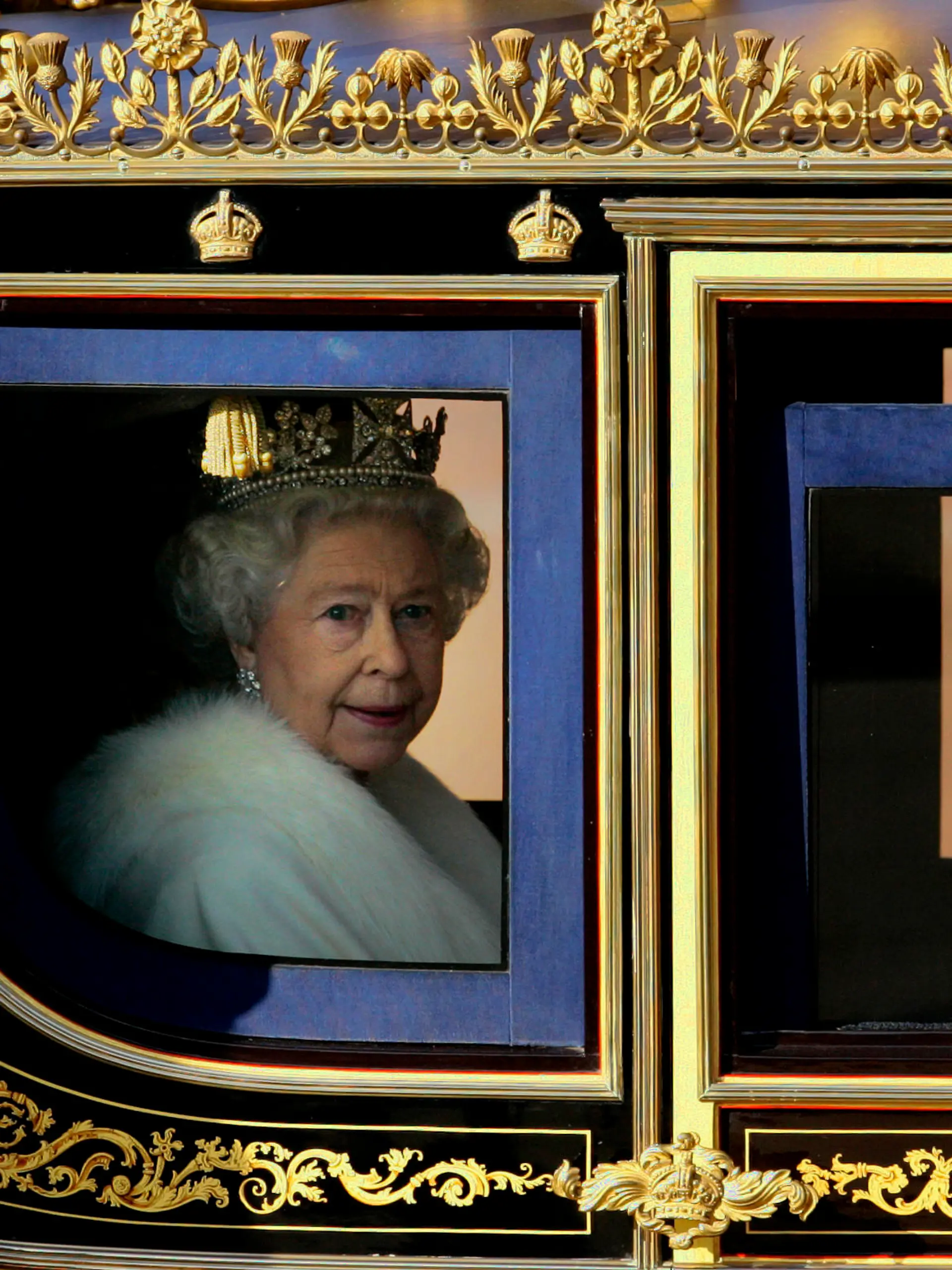 Britain's Queen Elizabeth II leaves Buckingham Palace in a carriage to attend the State opening of Parliament in London, Nov. 6, 2007. (AP Photo/Kirsty Wigglesworth)