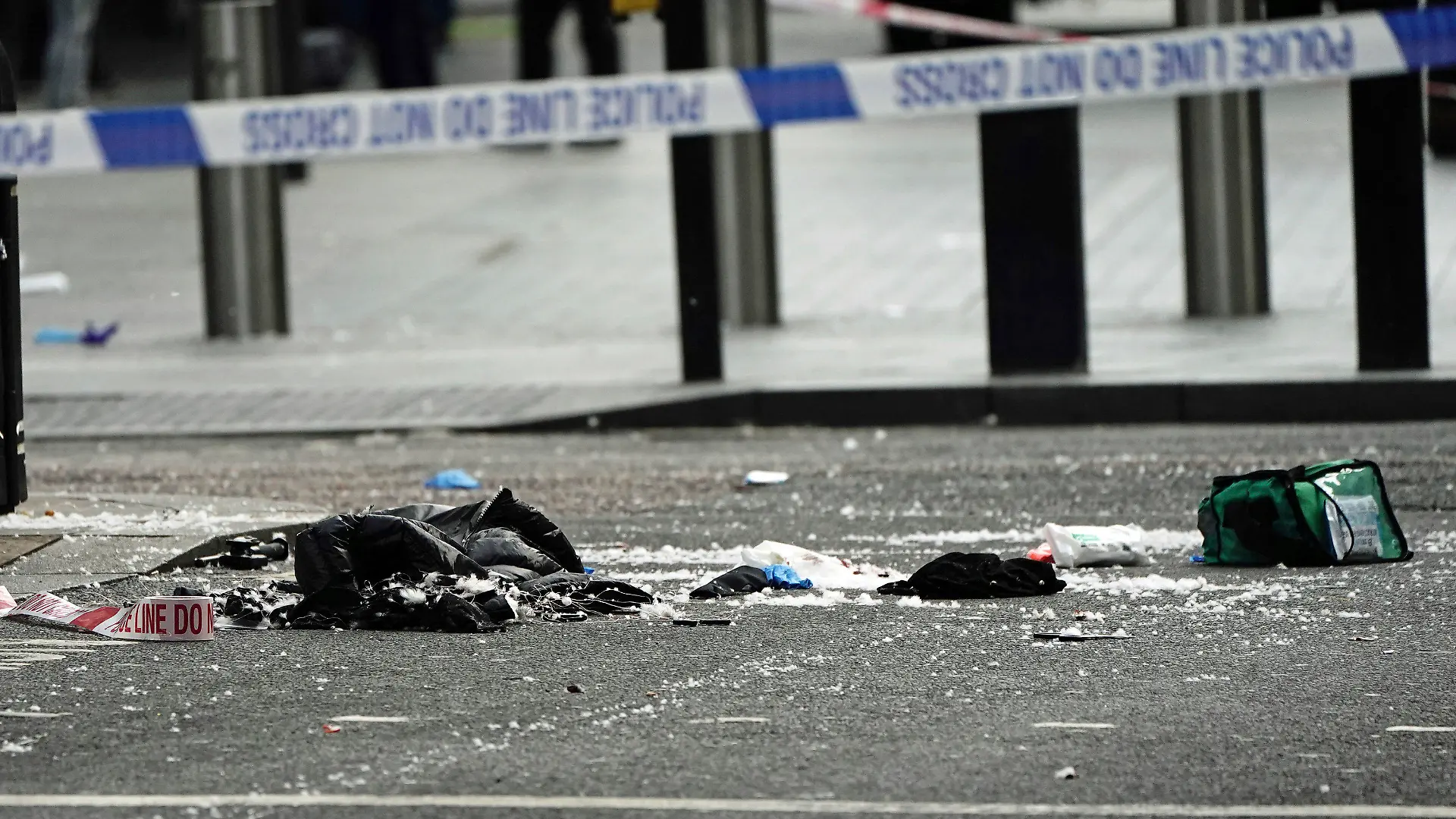 Items in the street at the scene in Shaftesbury Avenue, where two male police officers were stabbed, in London, Friday, Sept. 16, 2022. London’s police force says two officers have been hospitalized after being stabbed in central London early Friday. It says the attack is not being treated as terrorism. The Metropolitan Police force says officers “encountered a man with a knife” in the Leicester Square area, a busy tourist hub, at around 6 a.m. (Aaron Chow/PA via AP)