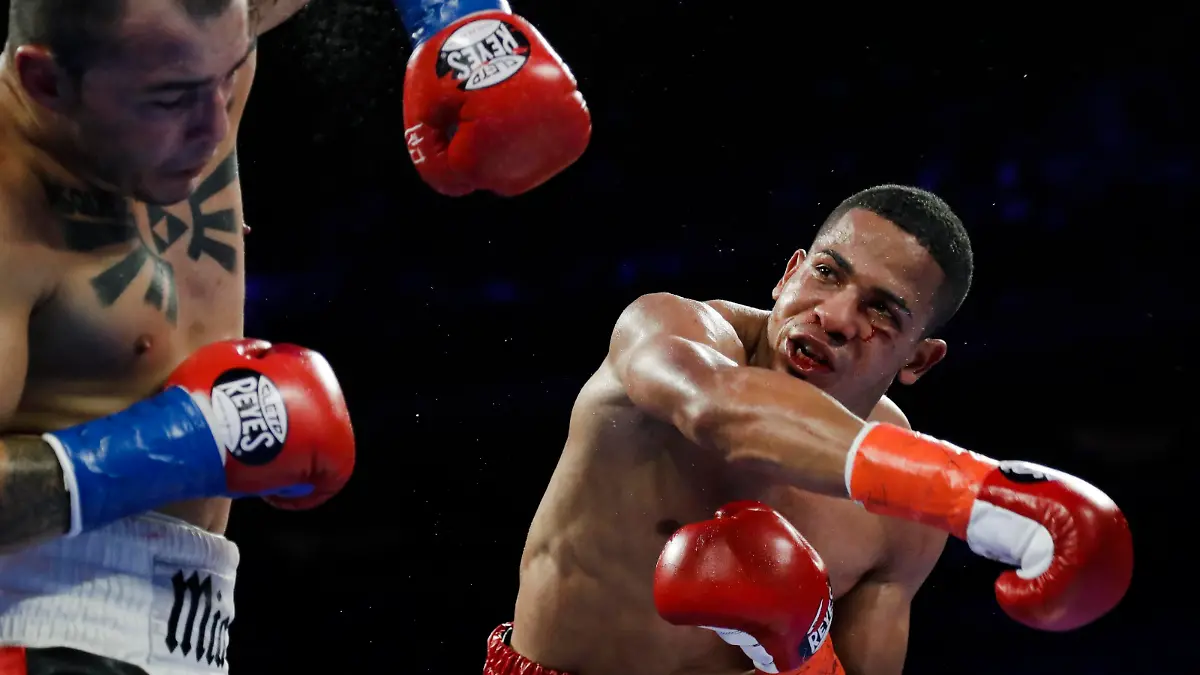 FiLE - In this April 20, 2019 file photo, Puerto Rico's Felix Verdejo, right, punches Costa Rica's Bryan Vazquez during the fifth round of a lightweight boxing match in New York. Verdejo has turned himself in to federal agents on Saturday, May 1, 2021, just hours after authorities identified the body of his 27-year-old lover Keishla Rodríguez in a lagoon in the U.S. territory, a couple of days after she was reported missing. (AP Photo/Frank Franklin II, File)