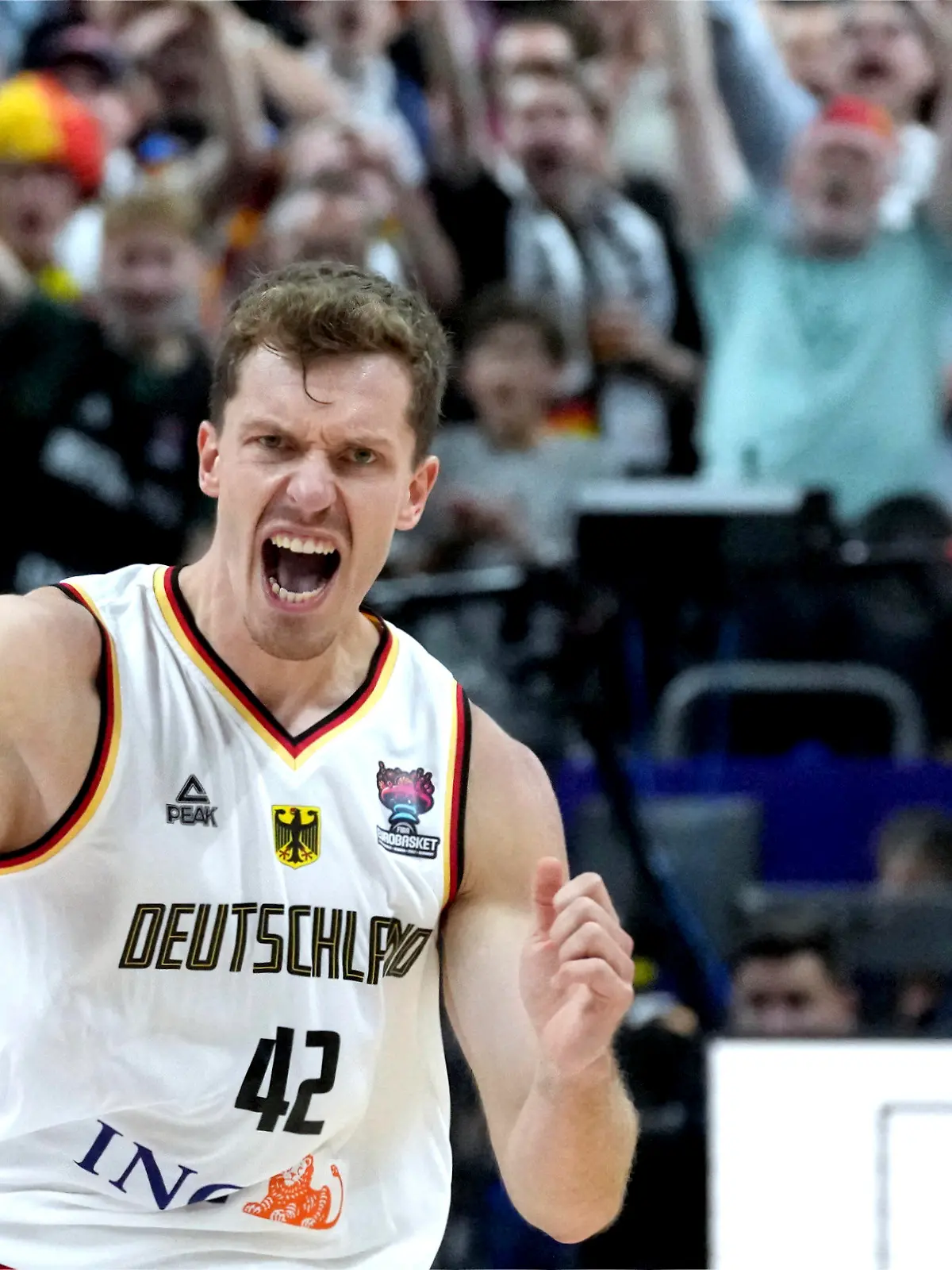 Germany's Andreas Obst celebrates during the Eurobasket quarterfinal basketball match between Germany and Greece in Berlin, Germany, Tuesday, Sept. 13, 2022. (AP Photo/Michael Sohn)