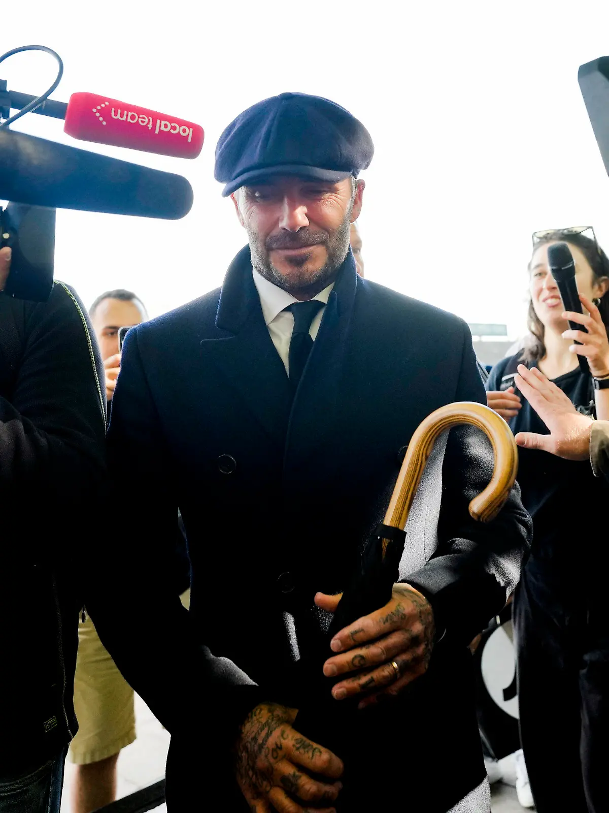 David Beckham is surrounded media as he leaves Westminster Palace paying respect to the late Queen Elizabeth II during the Lying-in State, in Westminster Hall, London, England, Friday, Sept. 16, 2022. The Queen will lie in state in Westminster Hall for four full days before her funeral on Monday Sept. 19. (AP Photo/Markus Schreiber)