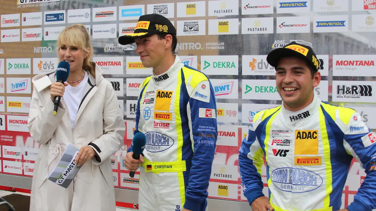 Interview mit den SiegernRennen 1, Samstag, #91 Christian Engelhardt (DEU) / Ayhancan Gueven (TUR), Porsche 911 GT3-R, Team: Joos Sportwagentechnik (DEU) und Nitro Moderatorin Eve Scheer, ADAC GT Masters 2022, Lausitzring, Rennen 1, Samstag, 20.08.2022 - Foto: Augst/Eibner-Pressefoto