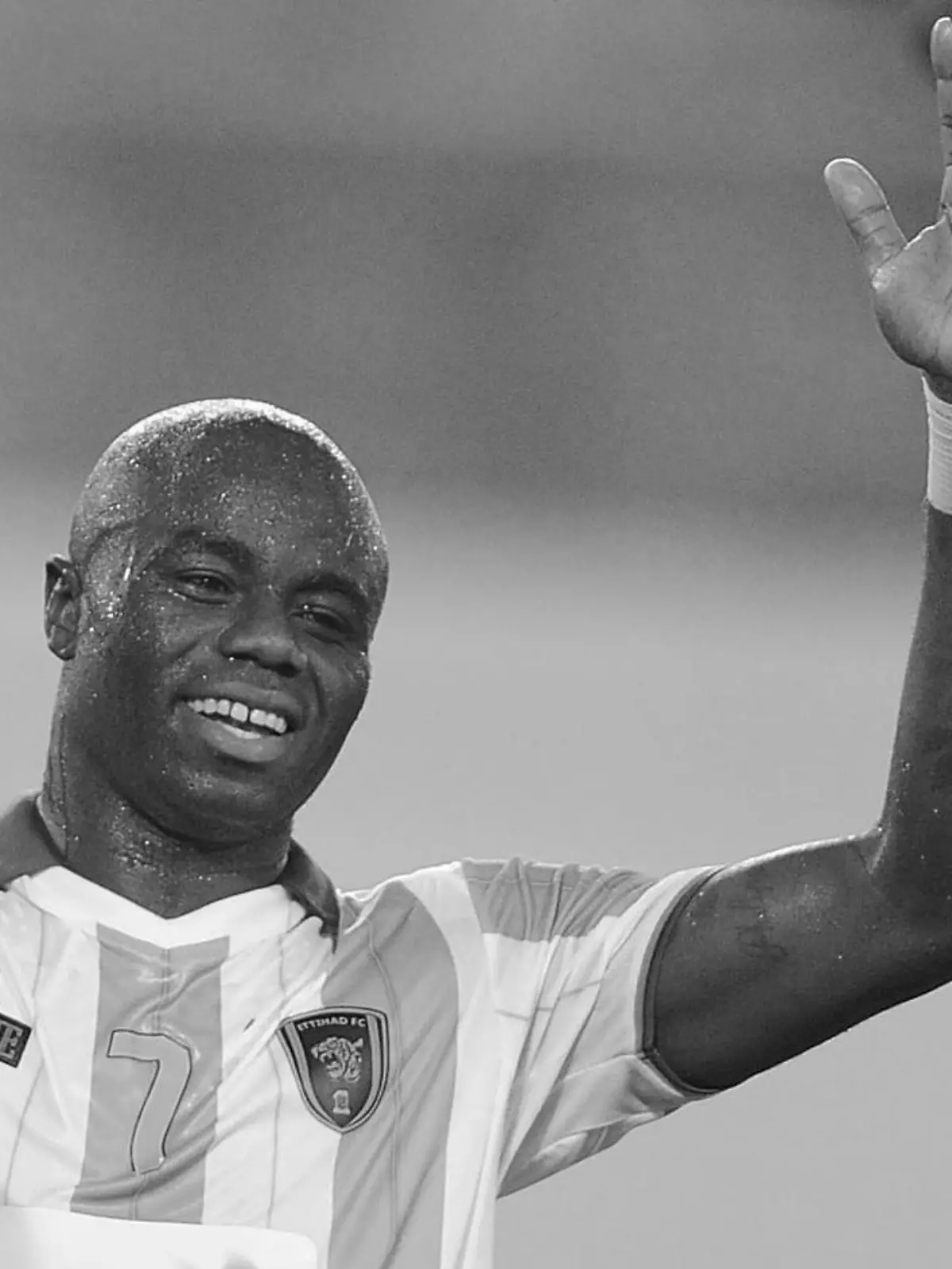 Al Ittihad's Modeste M'Bami (L) and Osama Al-Muwallad (R) celebrate as Guangzhou Evergrande's Feng Xiaoting (C) reacts after a match at the AFC Champions League in Guangzhou in south China's Guangdong province on Tuesday, Oct. 2, 2012. A late Al Ittihad goal made it 1-2 in the match and 5-4 on aggregate. It sent Marcello Lippi's Guangzhou Evergrande crashing out of the AFC Champions League.(Photo By Fang Yingzhong/Color China Photo/AP Images)