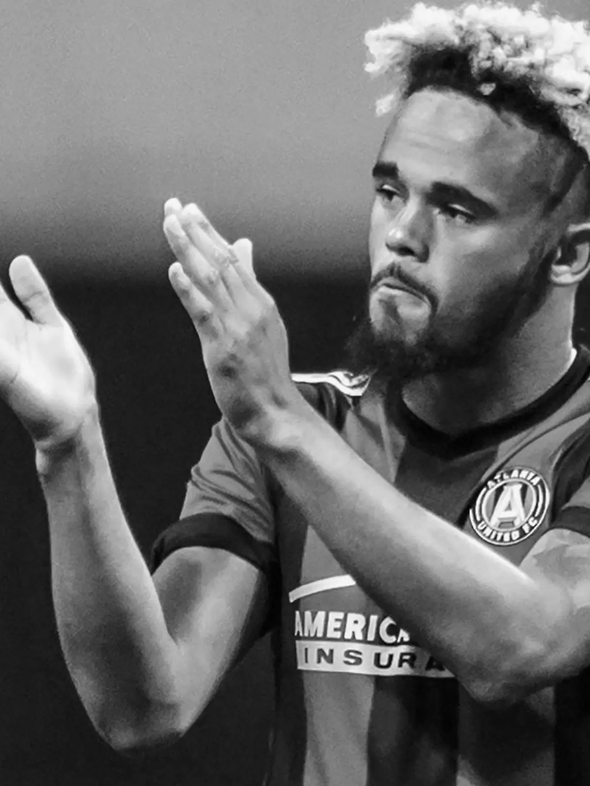 FILE - Atlanta United midfielder Anton Walkes (26) acknowledges the fans after an MLS playoff soccer game against Columbus Crew, in Atlanta, Thursday, Oct. 26, 2017. Soccer player Anton Walkes, who started his career at Tottenham, died Thursday, Jan. 19, 2023, after an accident in Florida, his MLS club Charlotte FC said. He was 25.(AP Photo/Danny Karnik, File)
