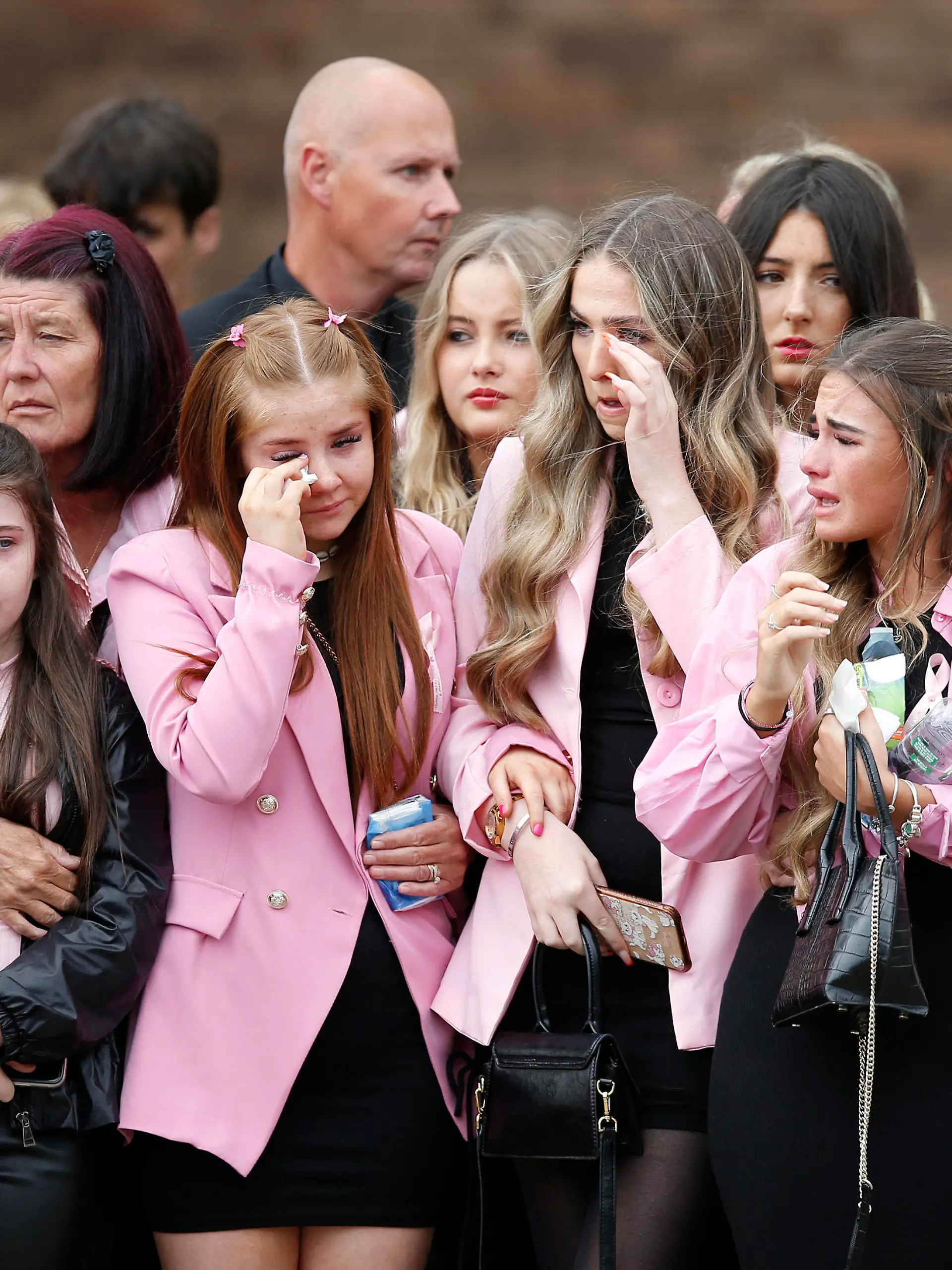 Mourners as the coffin of nine-year-old Olivia Pratt-Korbel is taken to her funeral in Liverpool, Britain, September 15, 2022 REUTERS/Craig Brough