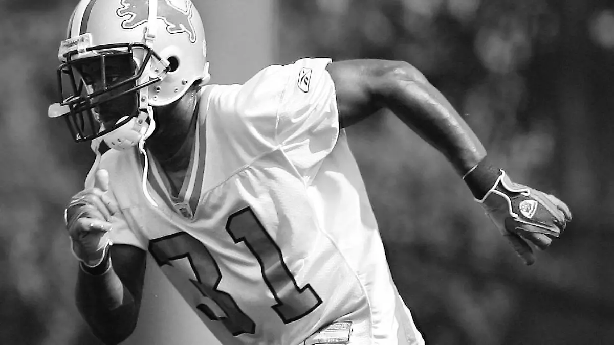 FILE - In this Aug. 7, 2006, file photo Detroit Lions' Stanley Wilson goes through running drills during the team's training camp at the training facility in Allen Park, Mich. Authorities say a homeowner in Portland, Oregon, shot an intruder who turned out to be former Detroit Lions cornerback Stanley Wilson II. The Multnomah County Sheriff's Office says Wilson tried to break through the back window of a multimillion-dollar home. Wilson has been arrested on charges of burglary and criminal trespass. (Daniel Mears /Detroit News via AP, File) DETROIT FREE PRESS OUT; HUFFINGTON POST OUT; MANDATORY CREDIT