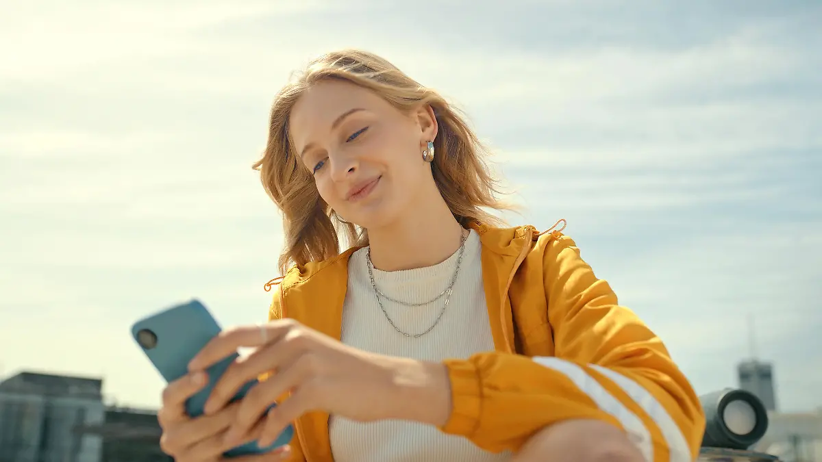 Phone, city and trendy woman on mobile app, chatting or texting for 5g networking, young fashion blog or social media. Streetwear student or gen z person on smartphone, cellphone and internet outdoor