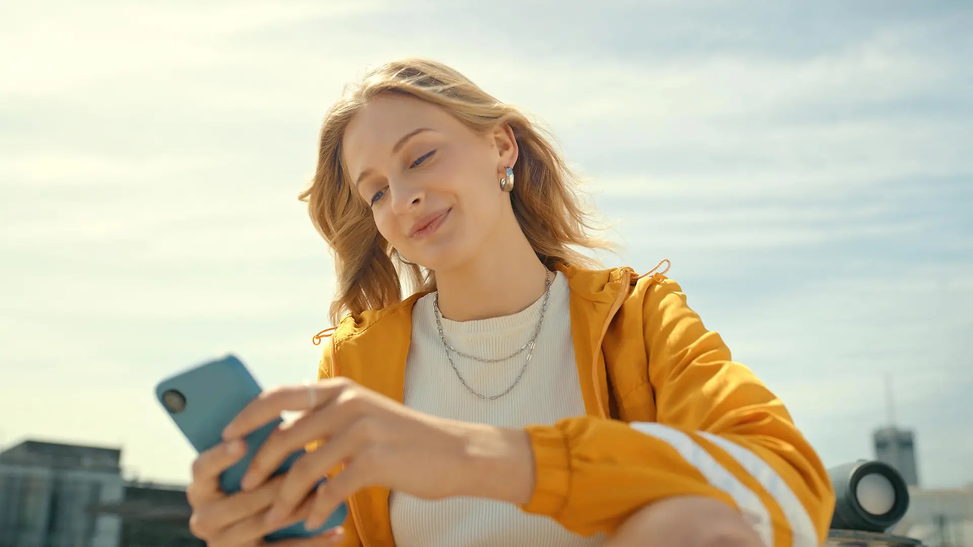 Phone, city and trendy woman on mobile app, chatting or texting for 5g networking, young fashion blog or social media. Streetwear student or gen z person on smartphone, cellphone and internet outdoor