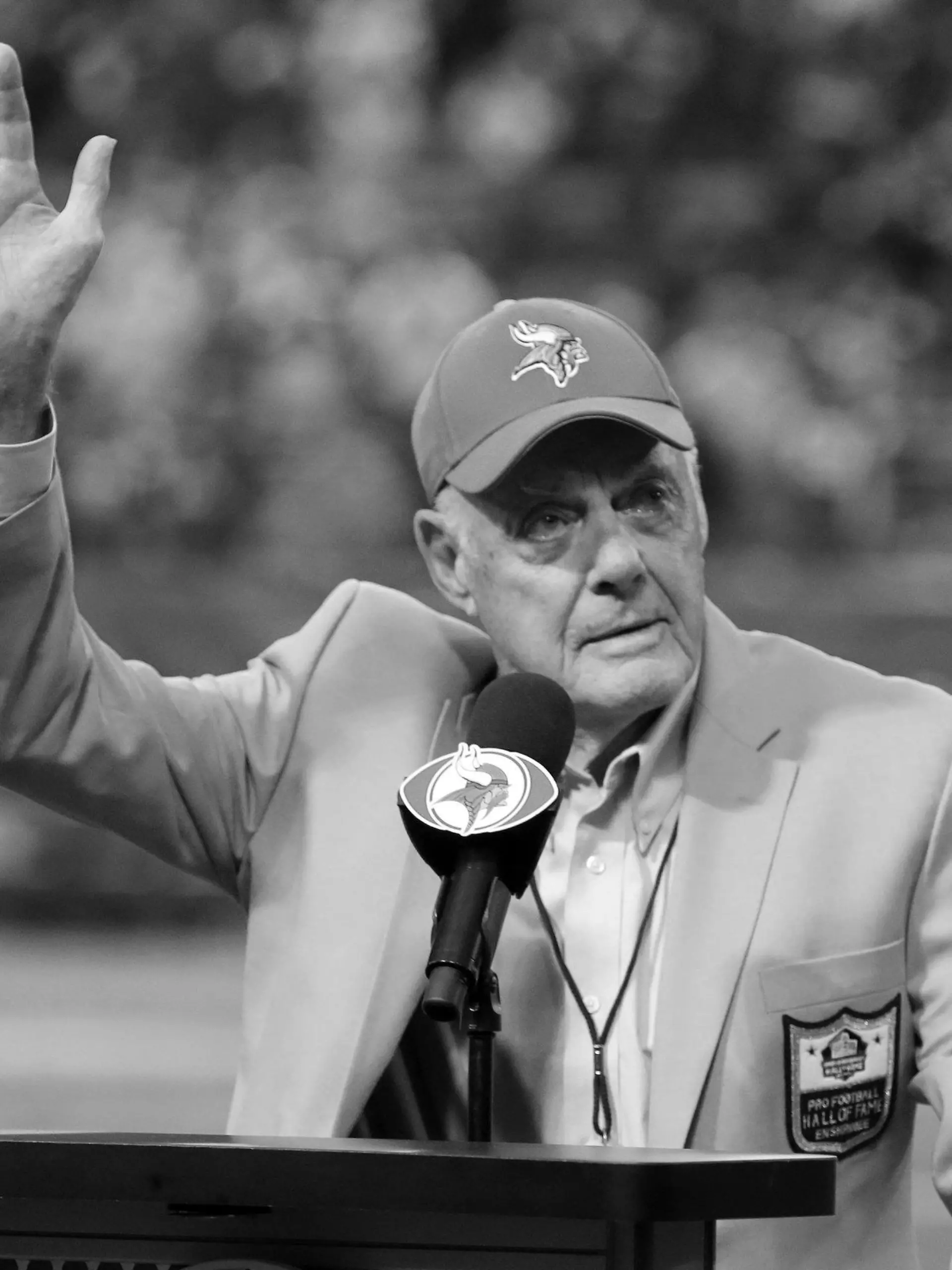 Former Minnesota Vikings Hall of Fame coach Bud Grant waves a final goodbye to the Metrodome during ceremonies following the Vikings NFL football against the Detroit Lions, Sunday, Dec. 29, 2013, in Minneapolis. Grant, the stoic and demanding Hall of Fame coach who took the Minnesota Vikings and their mighty Purple People Eaters defense to four Super Bowls in eight years and lost all of them, has died. He was 95. (AP Photo/Jim Mone, File