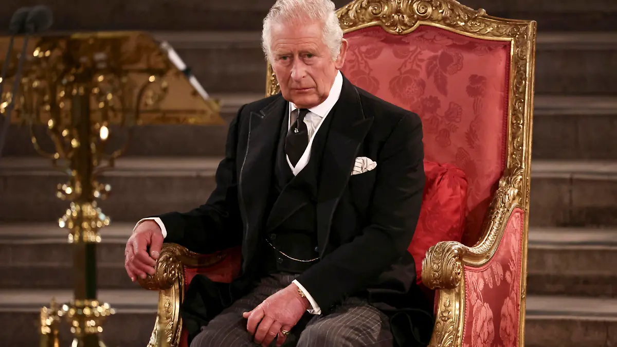 Britain's King Charles III sits at Westminster Hall, where both Houses of Parliament are meeting to express their condolences following the death of Queen Elizabeth II, at Westminster Hall, in London, Monday, Sept. 12, 2022. Queen Elizabeth II, Britain's longest-reigning monarch, died Thursday after 70 years on the throne. (Henry Nicholls/Pool Photo via AP)